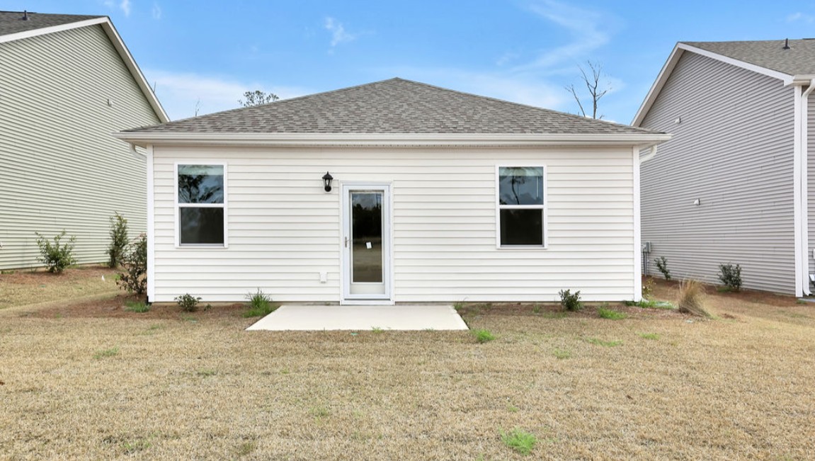 The Curtis is a three-bedroom, two-bathroom floor plan designed for modern living.It features an open-concept layout, where the kitchen comes with stainless steel appliances and a sleek peninsula countertop that overlooks the spacious living room, creating a great space for entertaining or relaxing. To the left of the front door, you'll find two bedrooms, a shared bathroom, and a convenient laundry room. At the back, the owner's suite offers a walk-in closet, a dual vanity, and a luxurious walk-in shower. If you're looking for a stylish and functional new home, the Curtis is a perfect choice. Enjoy the patio perfect for entertaining and enjoying the Carolina nights.