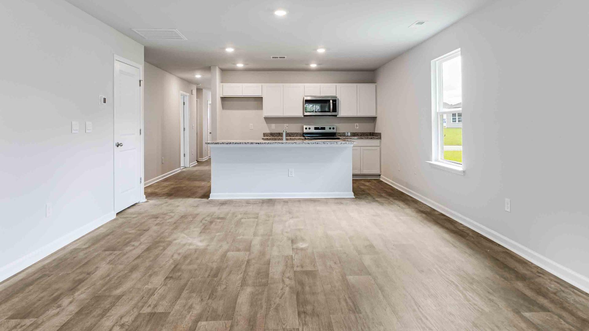 The Devon floor plan offers a spacious open-concept layout that seamlessly connects the living room and kitchen, creating an ideal space for entertaining. The living area is an open concept, where your kitchen, living, and dining areas blend seamlessly into a space perfect for everyday living and entertaining.