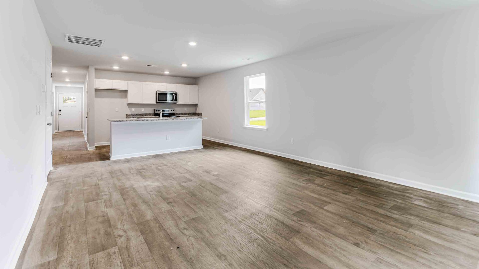 The Devon floor plan offers a spacious open-concept layout that seamlessly connects the living room and kitchen, creating an ideal space for entertaining. The living area is an open concept, where your kitchen, living, and dining areas blend seamlessly into a space perfect for everyday living and entertaining.