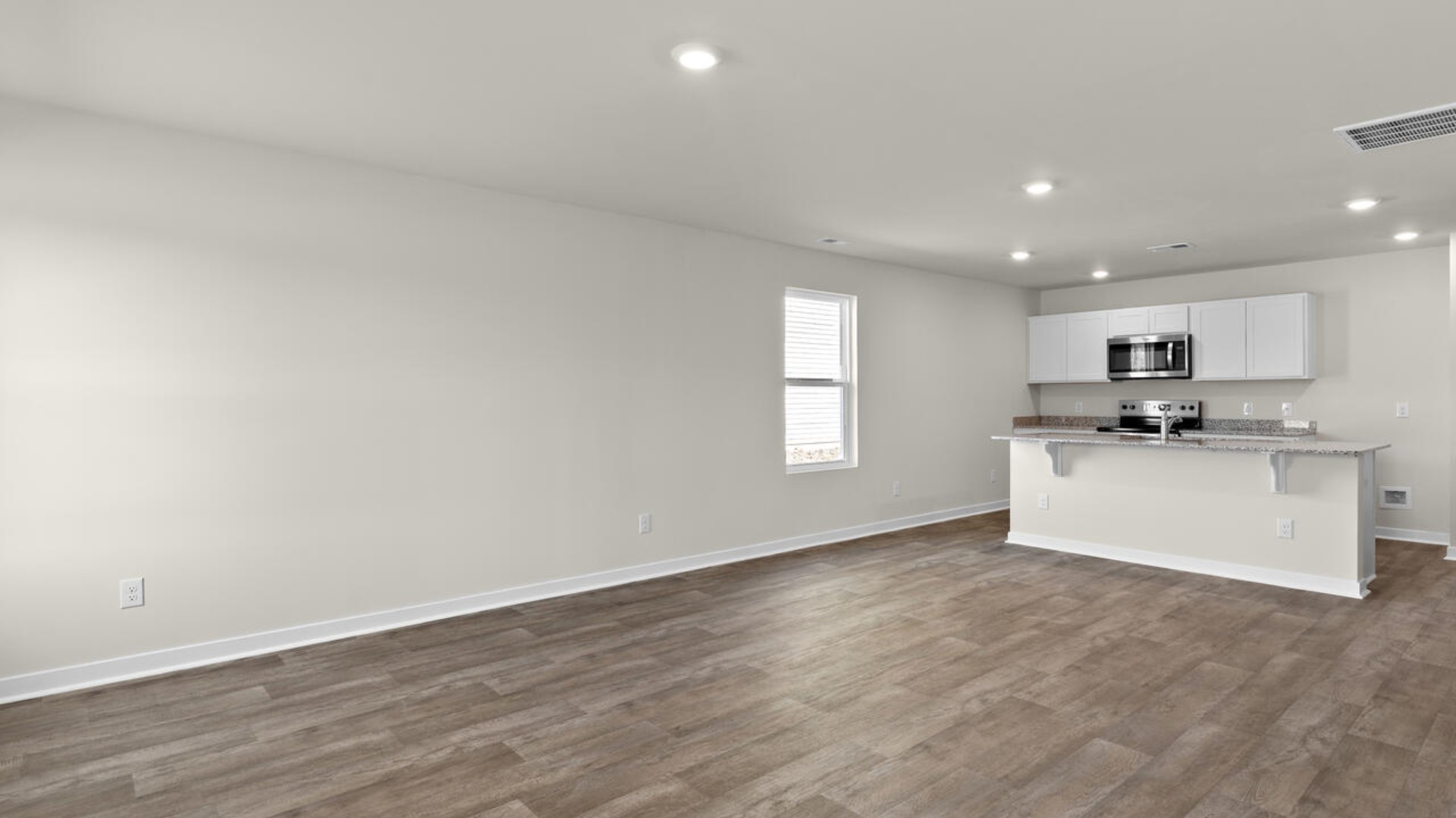 he living area is an open concept, where your kitchen, living, and dining areas blend seamlessly into a space perfect for everyday living and entertaining.