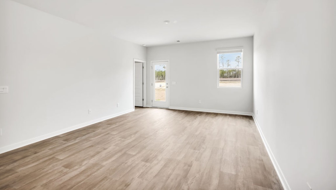 The Devon floor plan offers a spacious open-concept layout that seamlessly connects the living room and kitchen, creating an ideal space for entertaining. The Devon floor plan offers a spacious open-concept layout that seamlessly connects the living room and kitchen, creating an ideal space for entertaining.