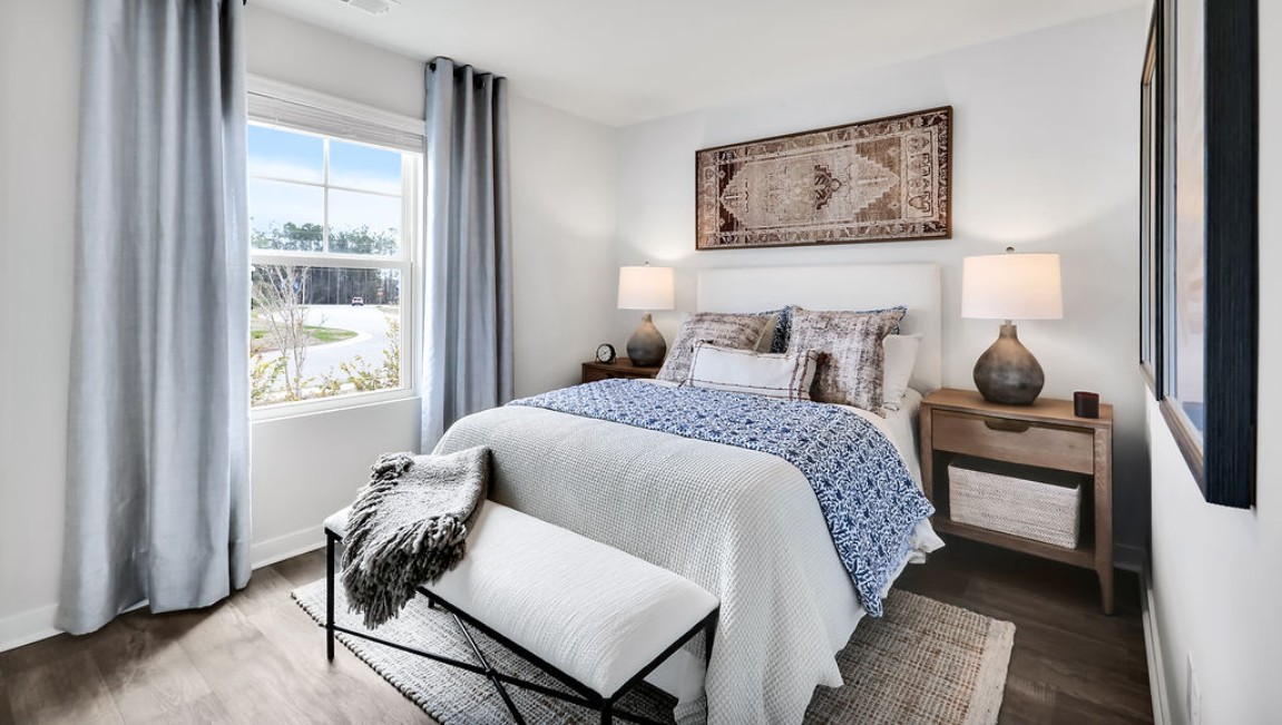 At the front are two guest bedrooms and a full bathroom, perfect for visitors or a home office.