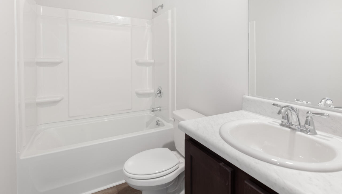 The Brandon offers an open floorplan where the great room leads into the dining room. The adjoining kitchen has a breakfast bar and pantry. Primary Suite with Deluxe Bath. Walk in closet off Primary Bath. Walk in laundry room. Two large secondary bedrooms with deep double door closet.