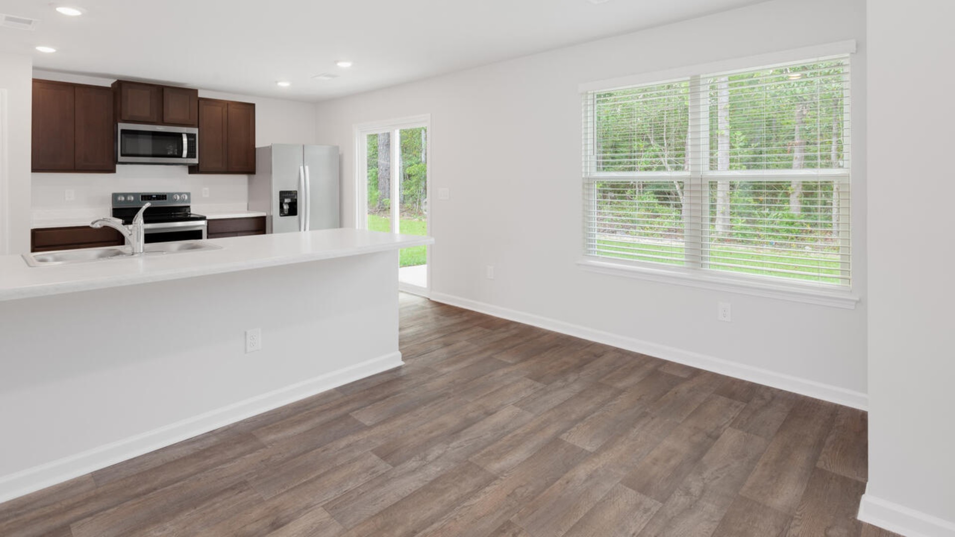 The Brandon offers an open floorplan where the great room leads into the dining room. The adjoining kitchen has a breakfast bar and pantry. Primary Suite with Deluxe Bath. Walk in closet off Primary Bath.