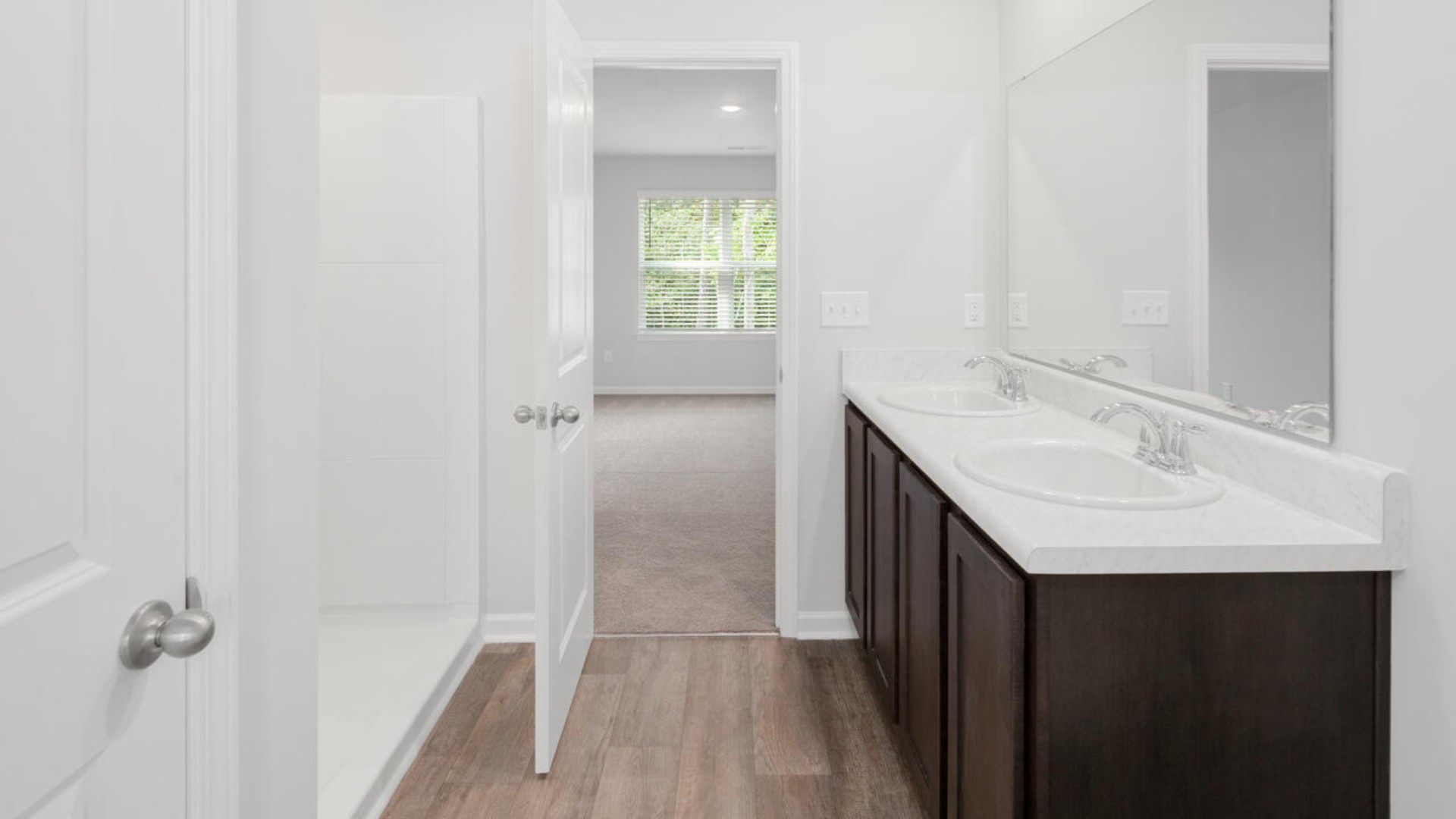 The Brandon offers an open floorplan where the great room leads into the dining room. The adjoining kitchen has a breakfast bar and pantry. Primary Suite with Deluxe Bath. Walk in closet off Primary Bath.