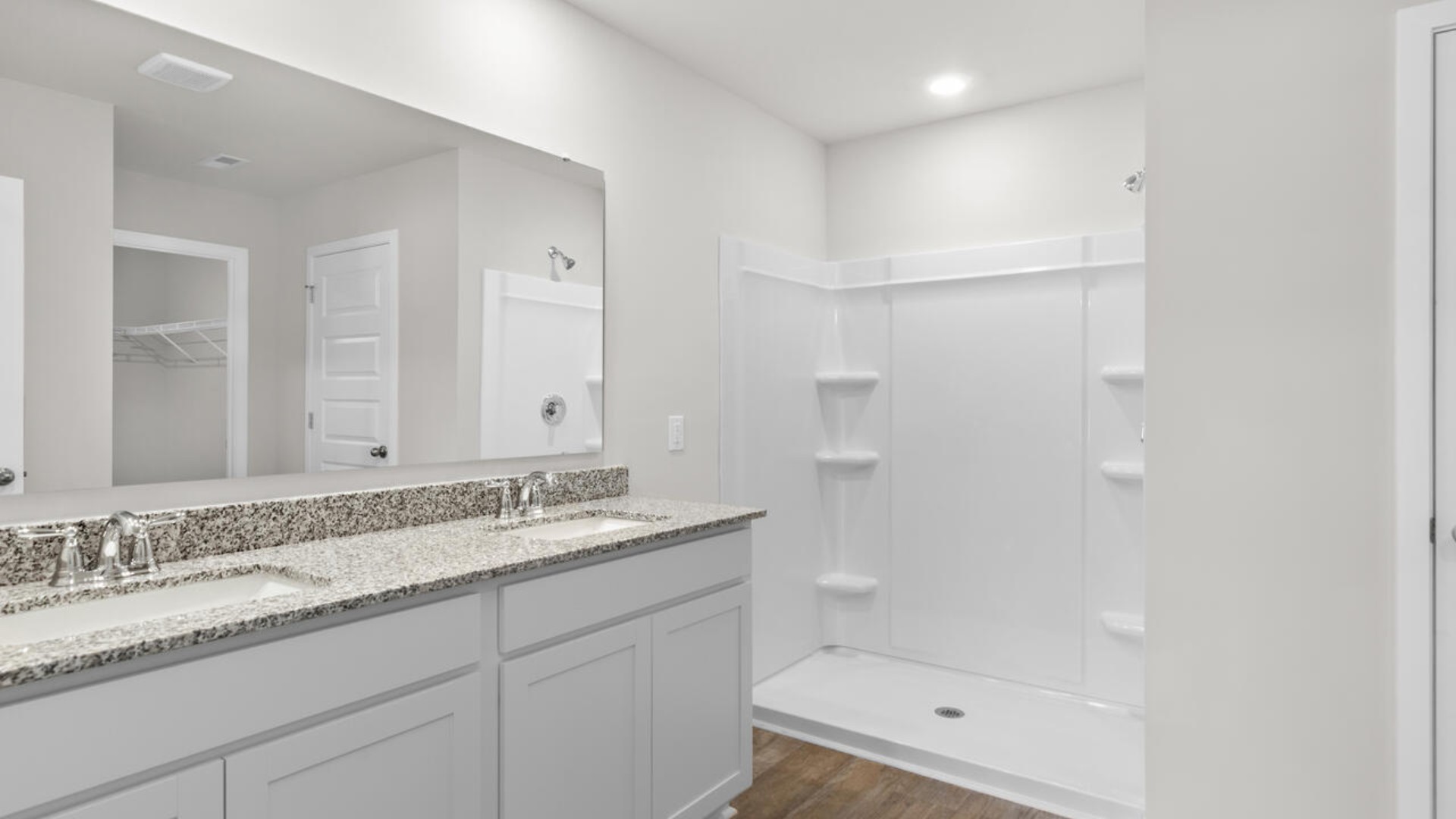 The primary bedroom has its own attached bathroom that features a walk-in closet and all the space you need to get ready in the morning.