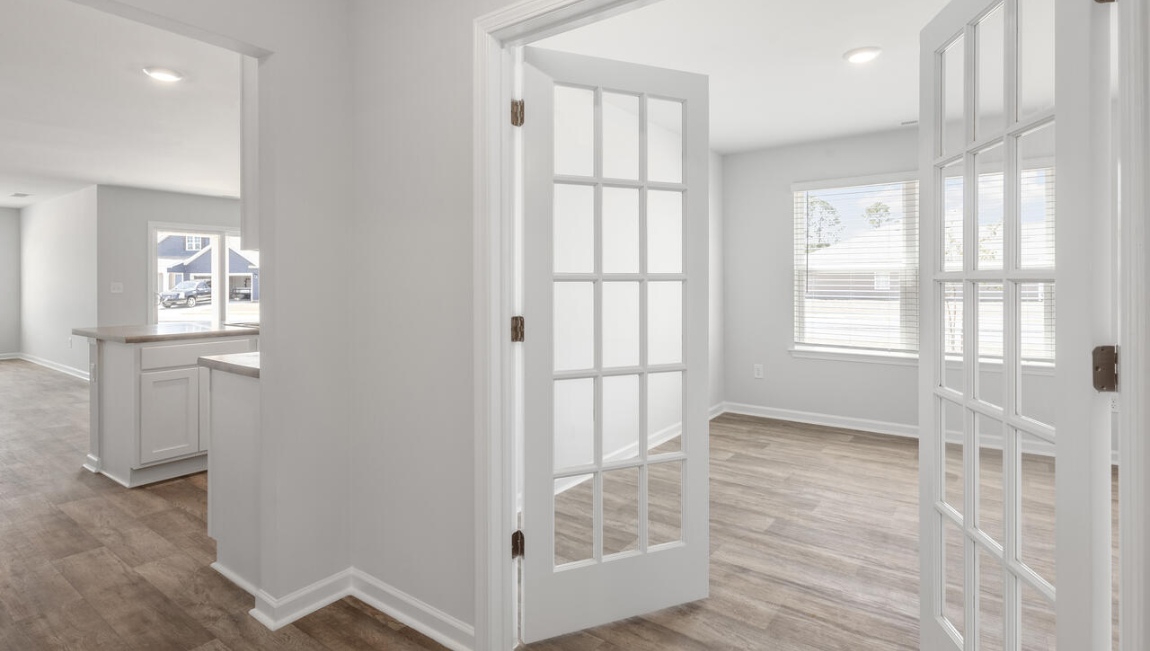 this floorplan was designed to make everyday living feel effortless. The heart of the home is the open kitchen, dining area, and family room that create a welcoming gathering space.