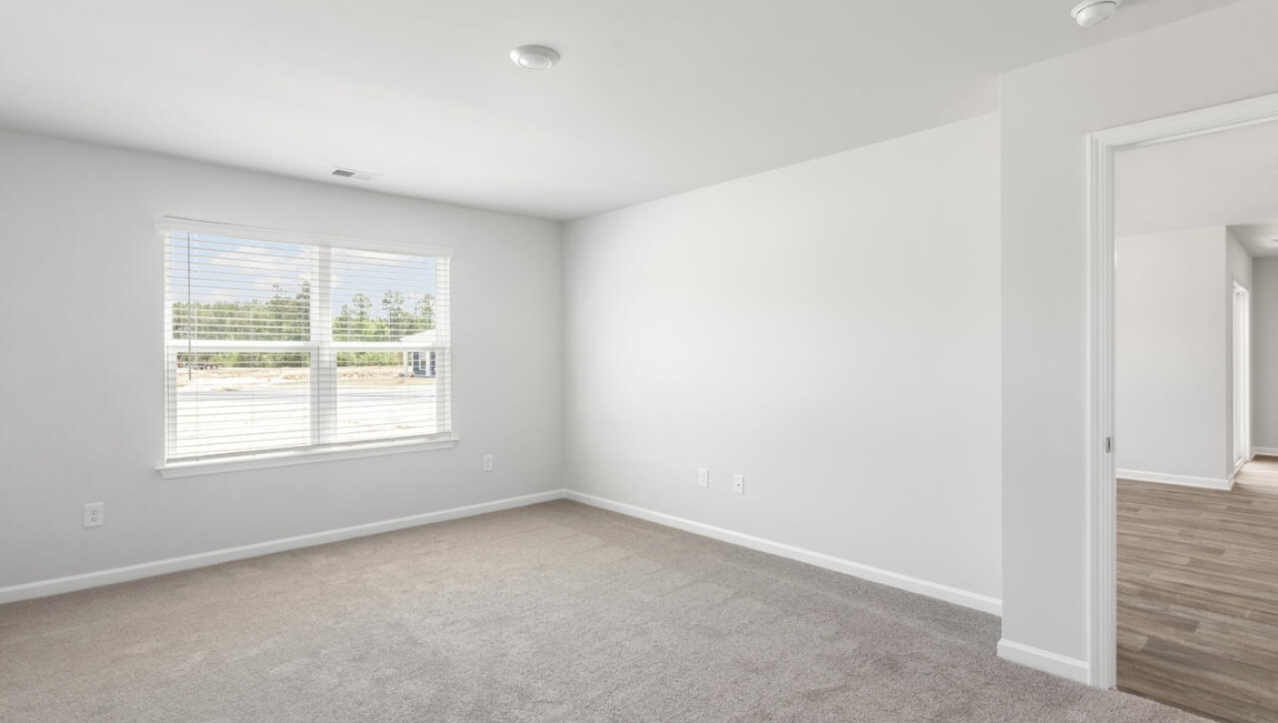 this floorplan was designed to make everyday living feel effortless. The heart of the home is the open kitchen, dining area, and family room that create a welcoming gathering space.