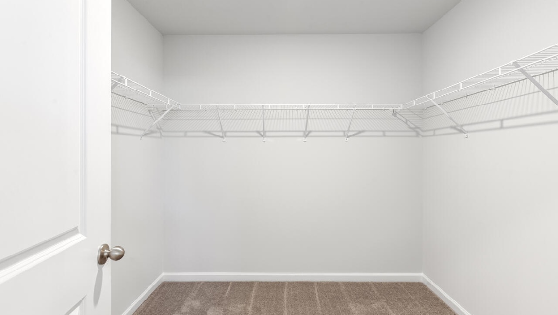 The primary bedroom has its own attached bathroom that features a walk-in closet and all the space you need to get ready in the morning.