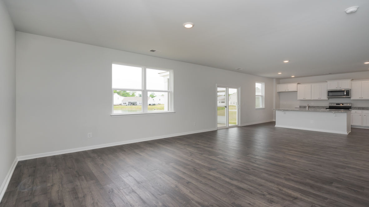he kitchen features stainless steel appliances, granite countertops an extra-large pantry, a lot of cabinet space, and an efficient layout that is open to the dining and family room.