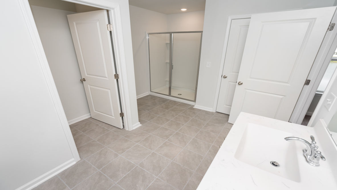 The primary bedroom is a perfect retreat with a walk-in closet and generous primary bathroom featuring a double vanity, large shower, and a separate linen closet. Plus, the laundry room is on the second floor with all the bedrooms!