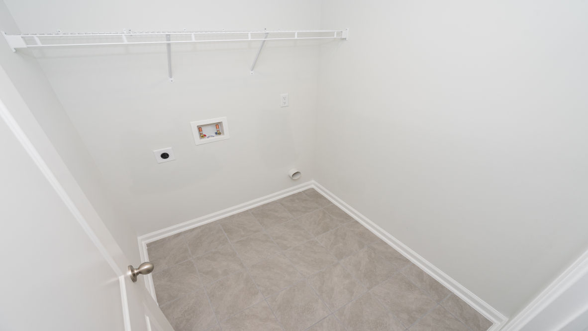 The primary bedroom is a perfect retreat with a walk-in closet and generous primary bathroom featuring a double vanity, large shower, and a separate linen closet. Plus, the laundry room is on the second floor with all the bedrooms!