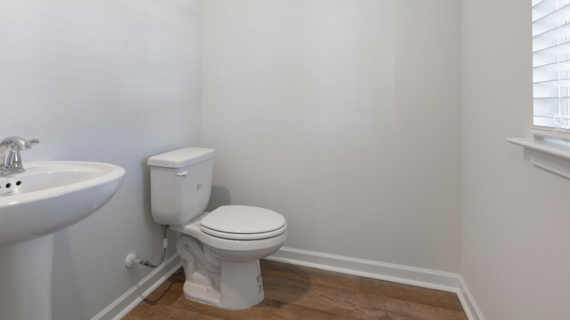 The kitchen features stainless steel appliances, granite countertops an extra-large pantry, a lot of cabinet space, and an efficient layout that is open to the dining and family room. The kitchen island is the perfect size for meal prep with a built-in sink and dishwasher.