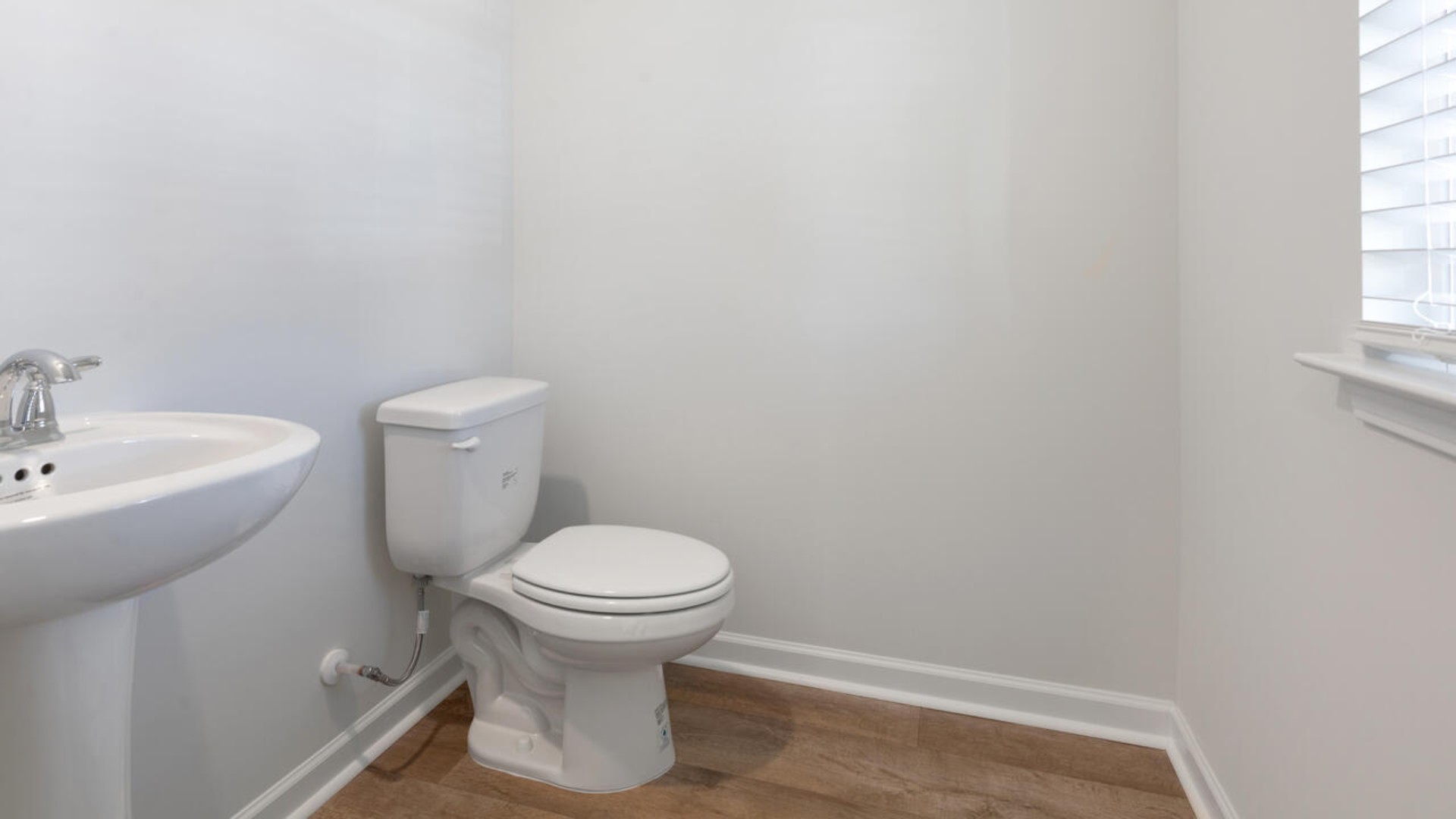 The kitchen features stainless steel appliances, granite countertops an extra-large pantry, a lot of cabinet space, and an efficient layout that is open to the dining and family room. The kitchen island is the perfect size for meal prep with a built-in sink and dishwasher.