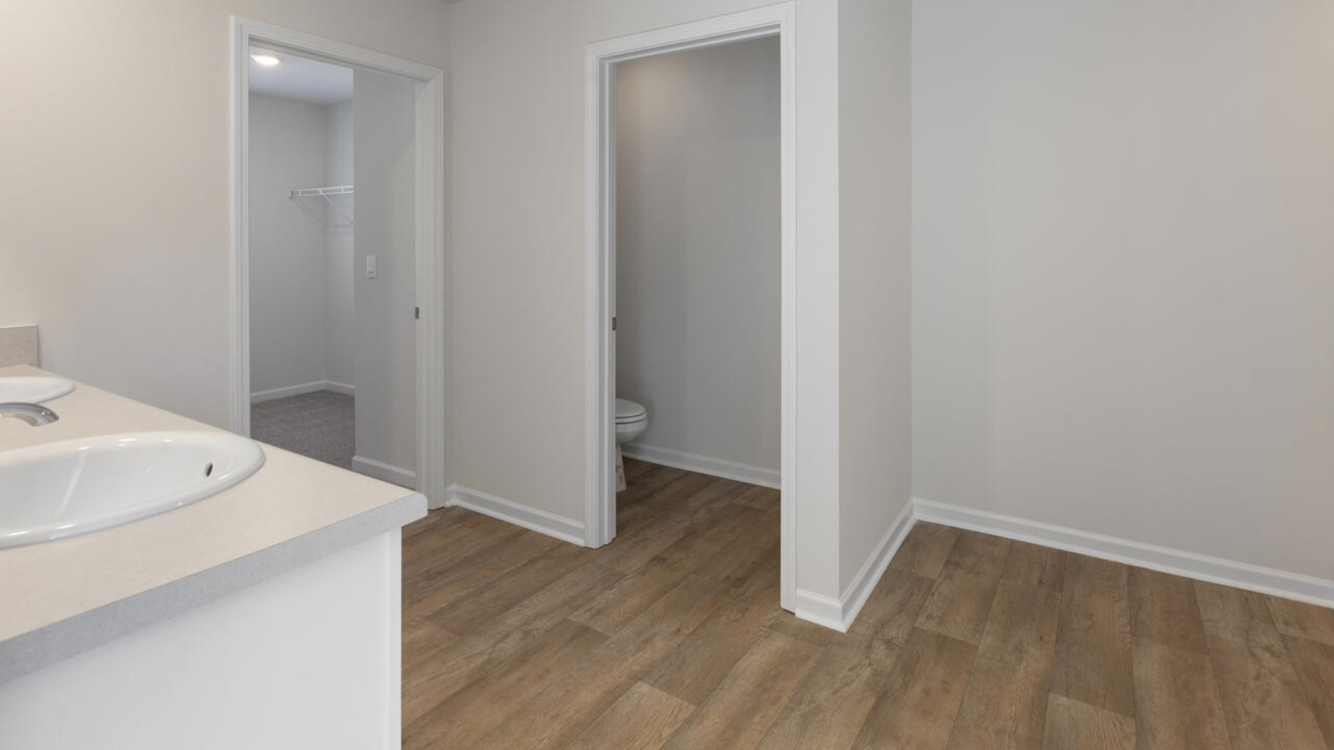 The primary bedroom is a perfect retreat with a walk-in closet and generous primary bathroom featuring a double vanity, large shower, and a separate linen closet. Plus, the laundry room is on the second floor with all the bedrooms!