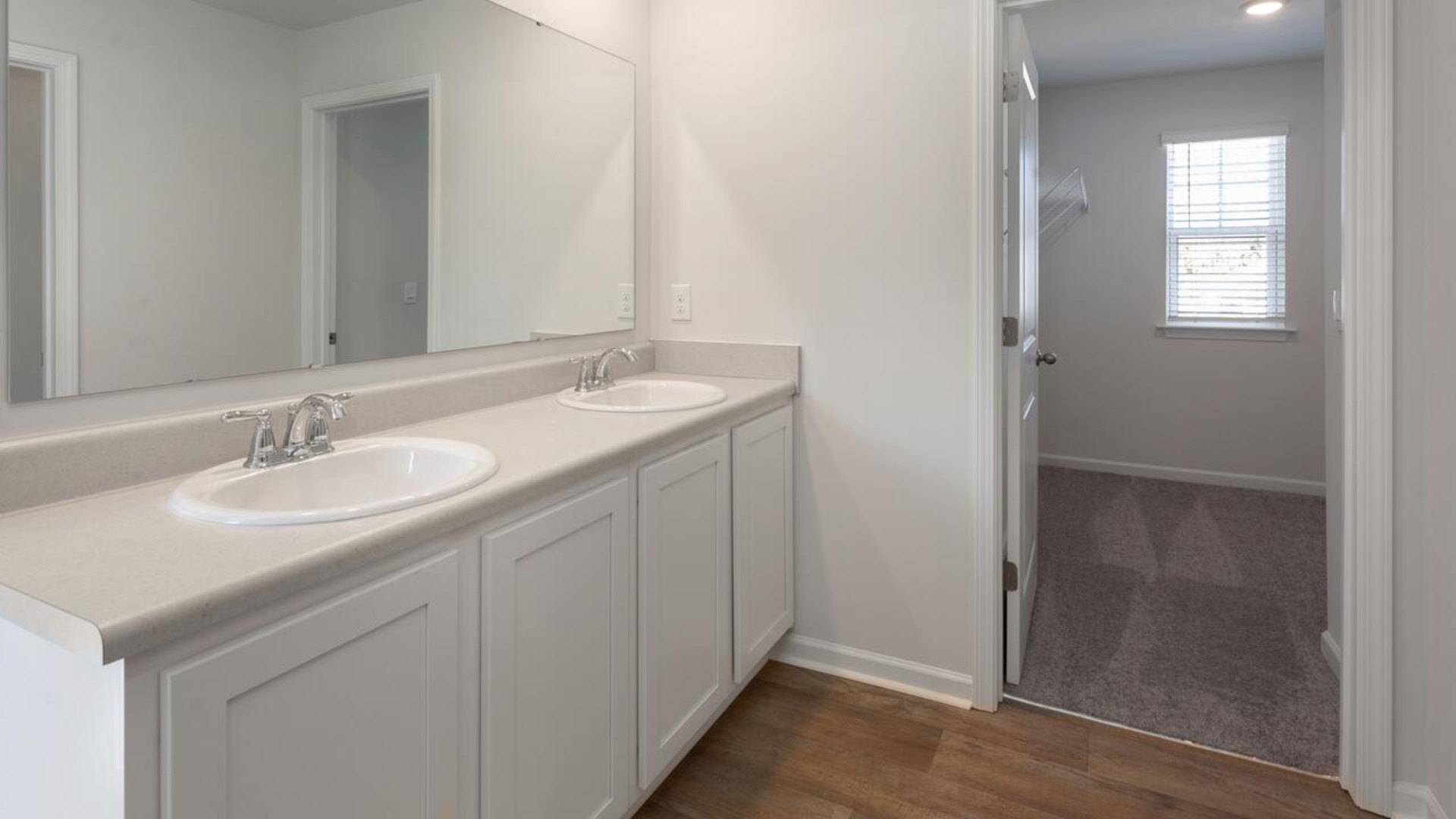 The primary bedroom is a perfect retreat with a walk-in closet and generous primary bathroom featuring a double vanity, large shower, and a separate linen closet. Plus, the laundry room is on the second floor with all the bedrooms!
