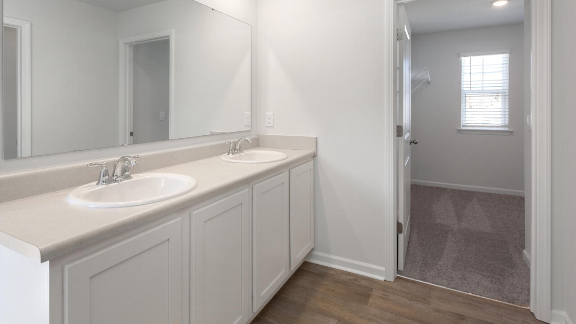 The primary bedroom is a perfect retreat with a walk-in closet and generous primary bathroom featuring a double vanity, large shower, and a separate linen closet. Plus, the laundry room is on the second floor with all the bedrooms!