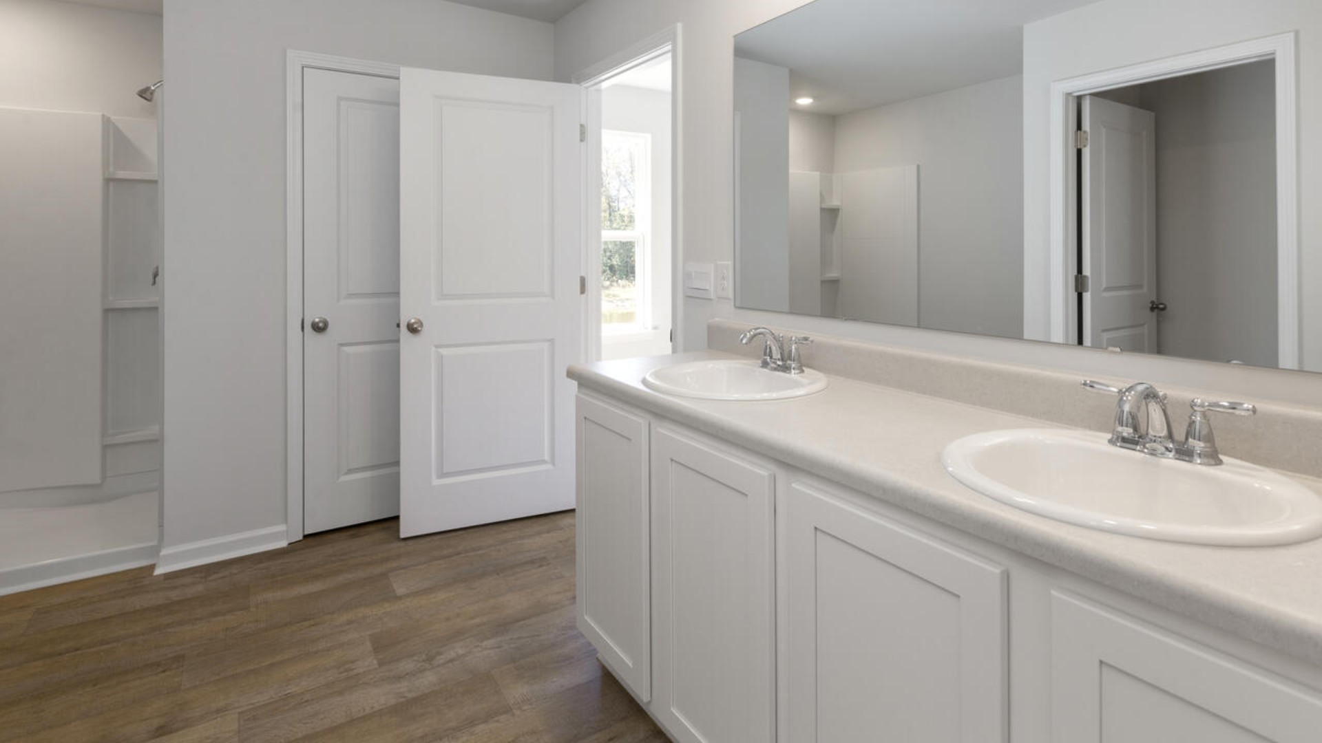 The primary bedroom is a perfect retreat with a walk-in closet and generous primary bathroom featuring a double vanity, large shower, and a separate linen closet. Plus, the laundry room is on the second floor with all the bedrooms!