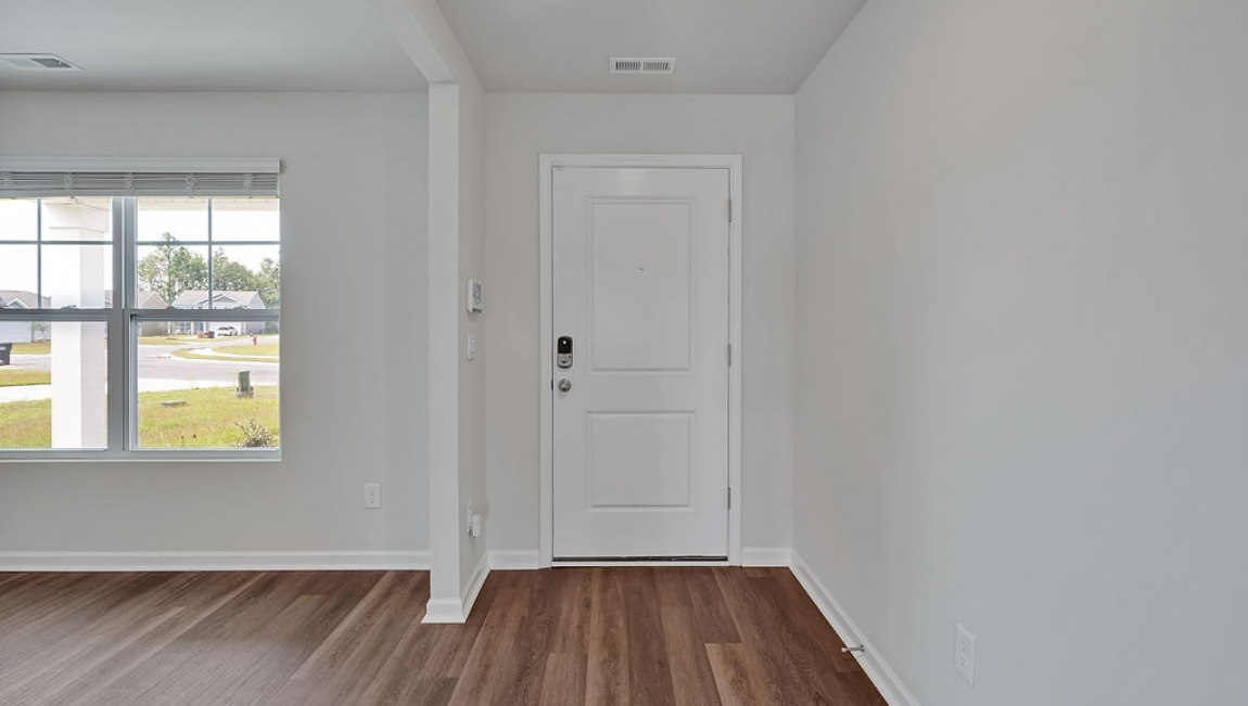 New Homes in Bolivia NC. Eagle Creek. The Hayden Floorplan offers 2,511 square feet with 5 bedrooms, 3 full bathrooms, and a 2-car garage. The upstairs has an additional living space, a laundry room, and a Primary Bedroom. Downstairs, a flex room can be used as an office or sitting area, while the open-concept kitchen features granite countertops and stainless steel appliances. The kitchen seamlessly connects to the dining and living areas, creating a great space for entertainment.