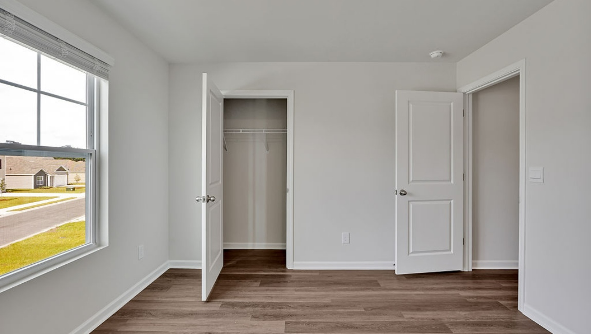 New Homes in Bolivia NC. Eagle Creek. The Hayden Floorplan offers 2,511 square feet with 5 bedrooms, 3 full bathrooms, and a 2-car garage. The upstairs has an additional living space, a laundry room, and a Primary Bedroom. Downstairs, a flex room can be used as an office or sitting area, while the open-concept kitchen features granite countertops and stainless steel appliances. The kitchen seamlessly connects to the dining and living areas, creating a great space for entertainment.