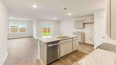 kitchen equipped with Stainless Steel Appliances, including a smooth-top electric range, microwave, granite countertop, dishwasher.