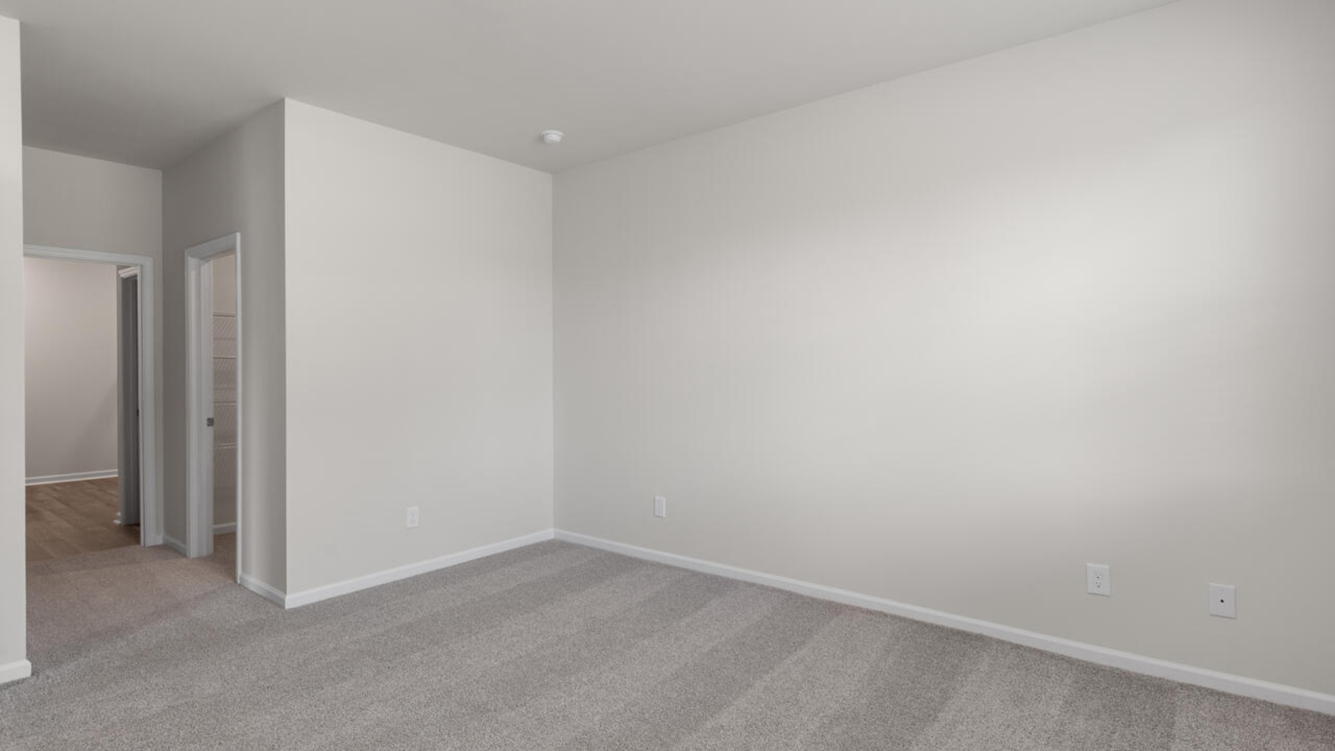 The Primary Suite offers a massive closet and a luxurious bathroom with a walk-in shower, linen closet, and dual vanity. I