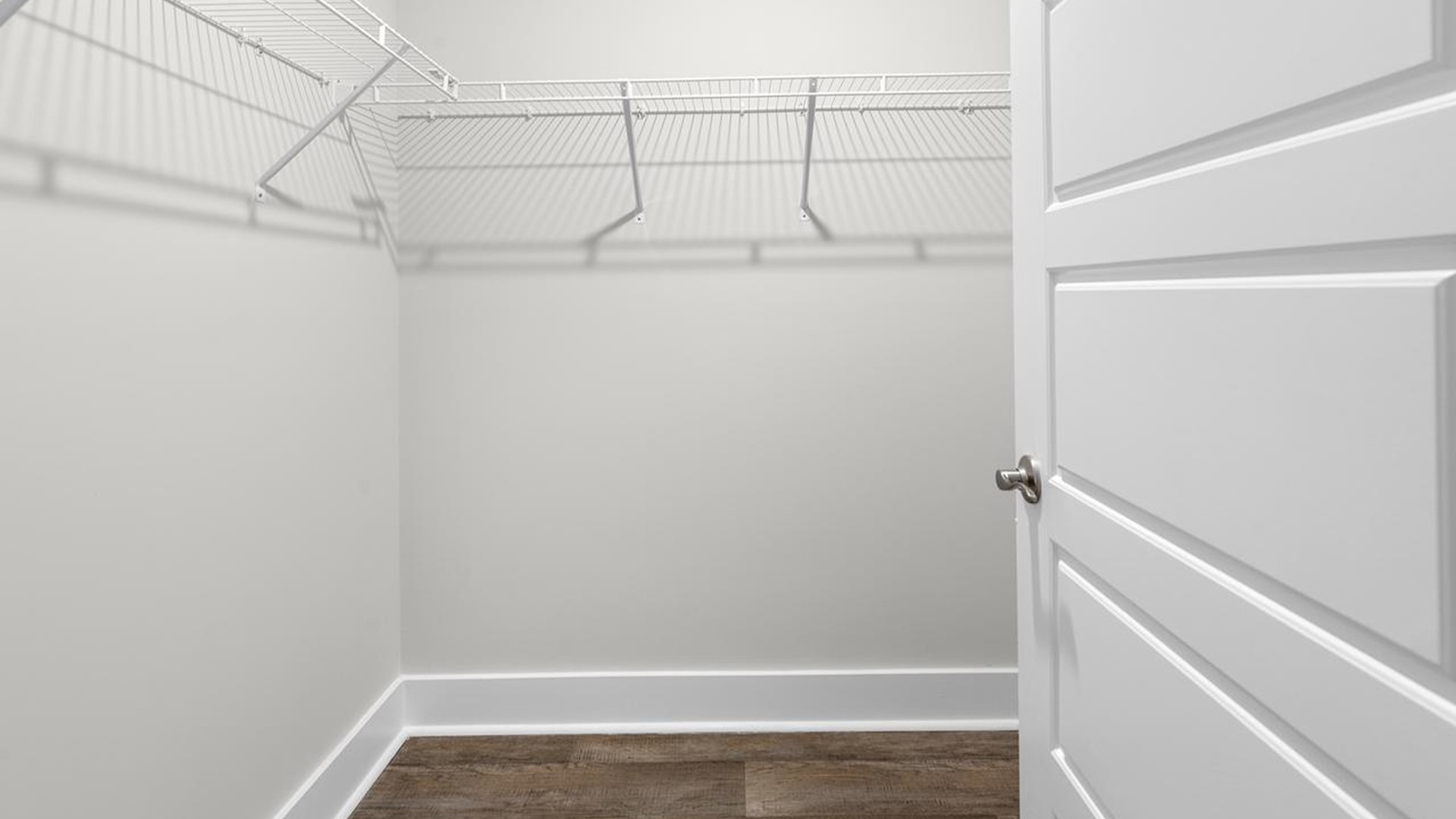 The primary suite offers a massive closet and a luxurious bathroom with a walk-in shower, linen closet, and dual vanity.