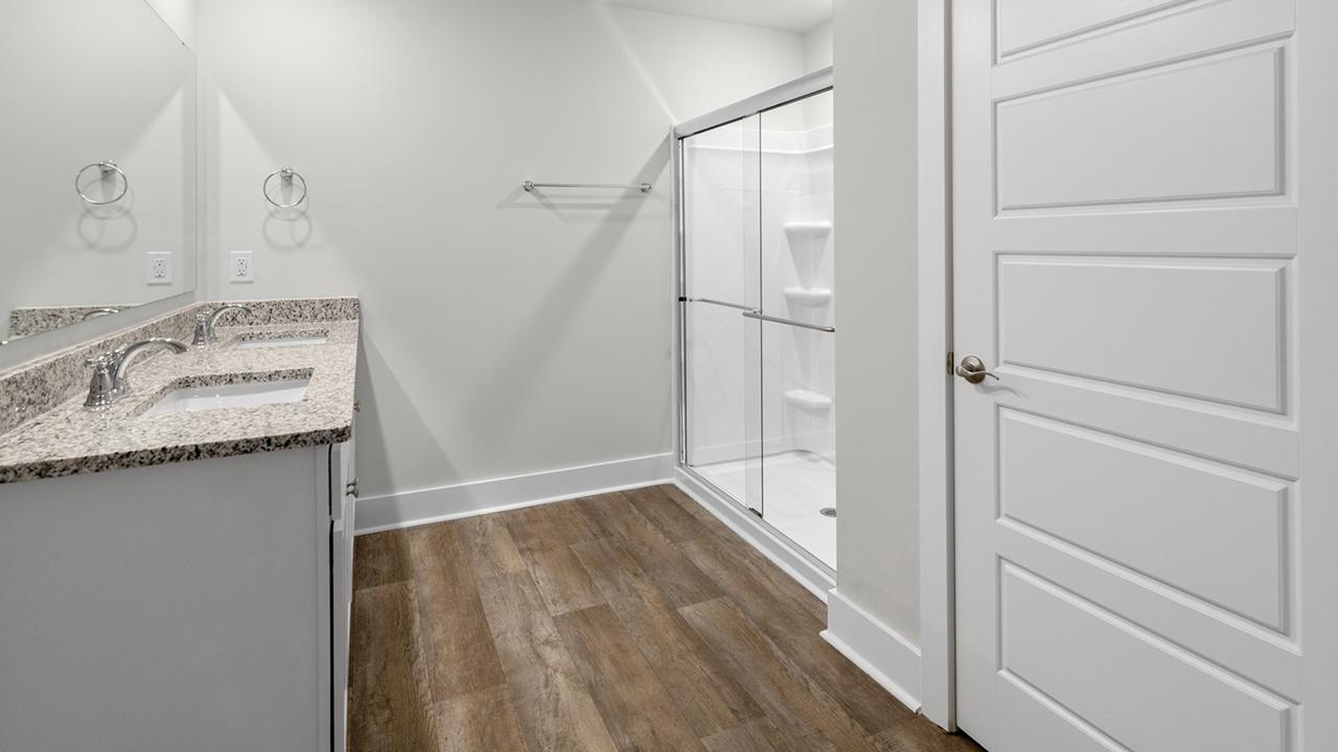 The primary suite offers a massive closet and a luxurious bathroom with a walk-in shower, linen closet, and dual vanity. In addition,
