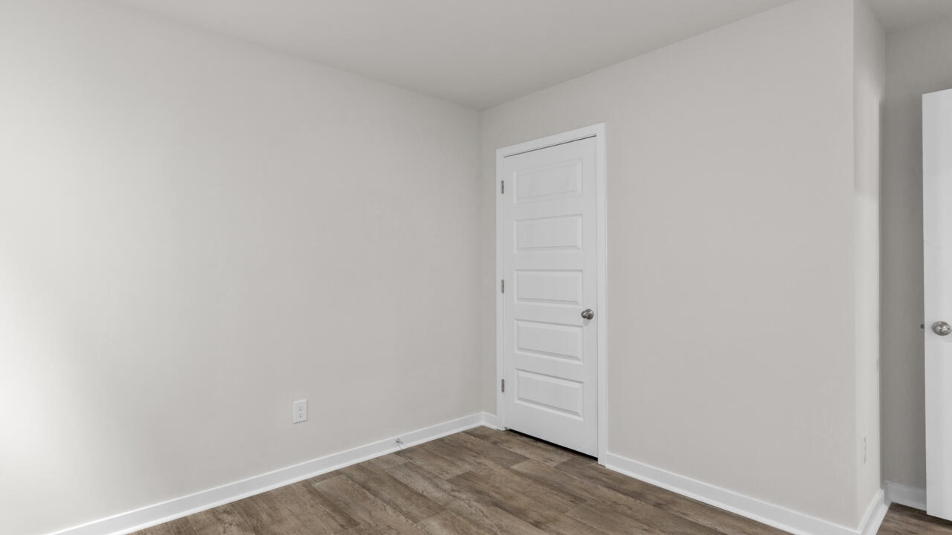 There are three additional bedrooms and full bath. In every bedroom you’ll have vinyl floors and a closet in each room.