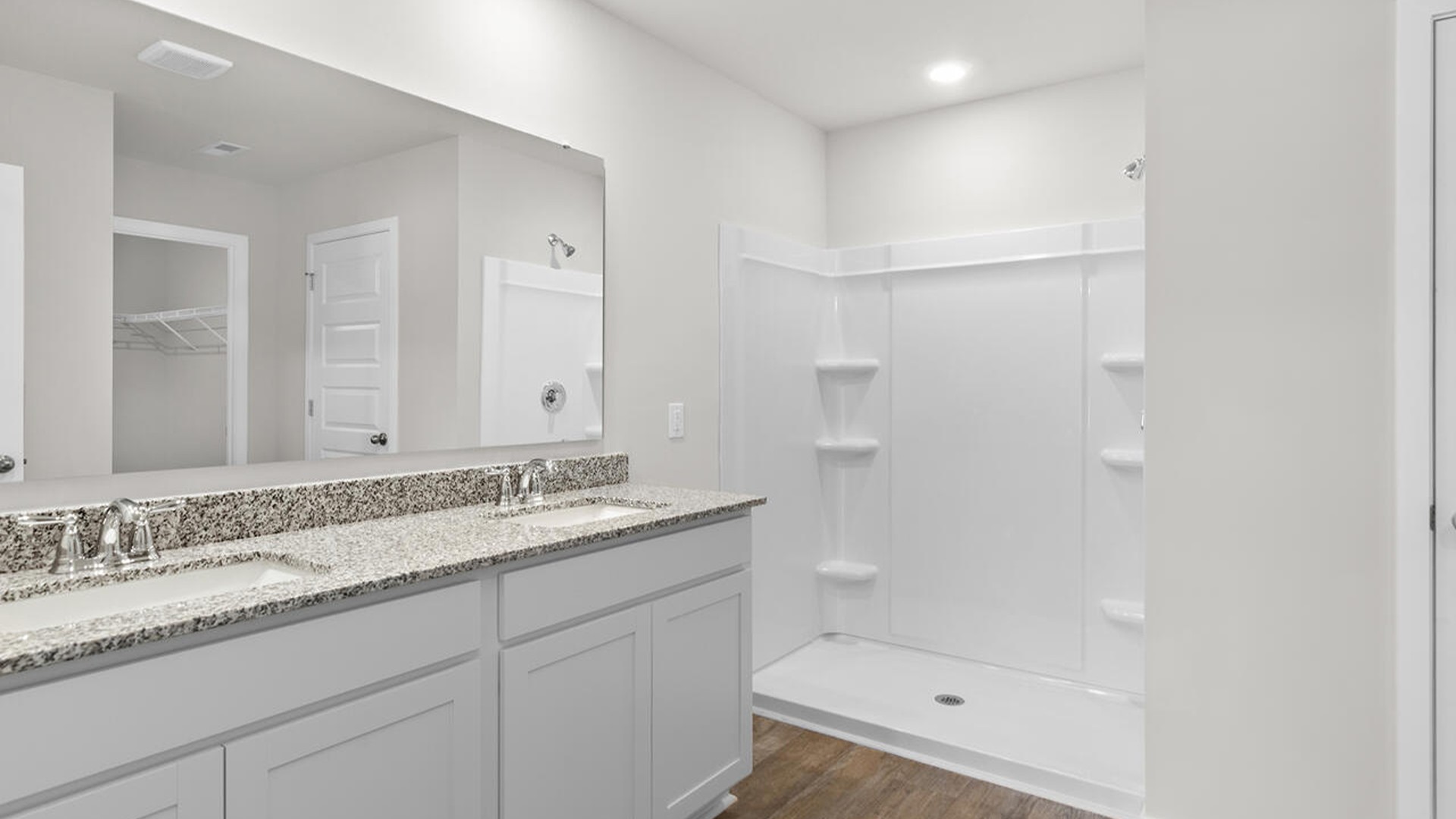 The primary bedroom has its own attached bathroom that features a walk-in closet and all the space you need to get ready in the morning.