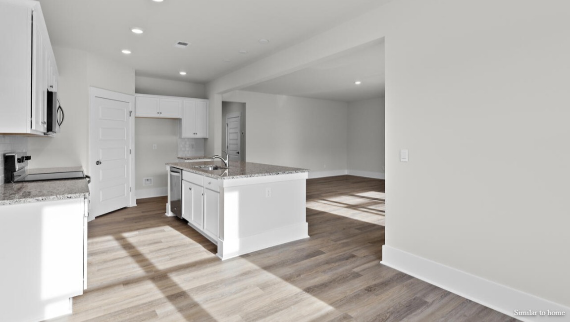 Enjoy coastal living at its best with a screened-in covered porch just off the open-concept kitchen, dining, and living areas — perfect for relaxing or entertaining.