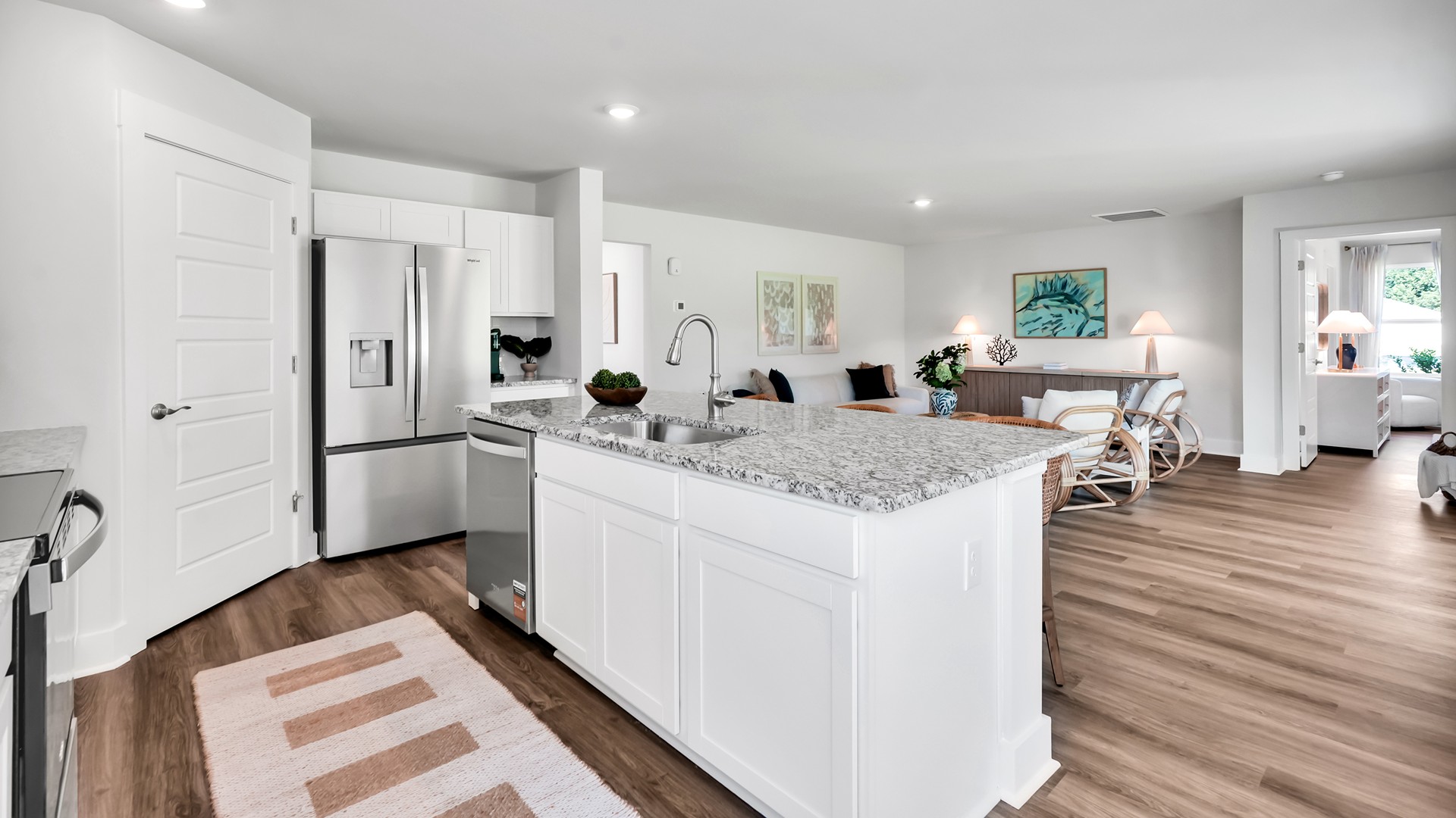 The Enjoy coastal living at its best with a screened-in covered porch just off the open-concept kitchen, dining, and living areas — perfect for relaxing or entertaining. The kitchen boasts stainless steel appliances, a walk-in pantry, and a generous island that flows seamlessly into the main living area. floorplan truly has it all — three-car garage, the spacious first floor features three bedrooms, including a guest ensuite, a flex room with elegant French doors. Inside you will find 4 bedrooms, 3 baths and 1,941 square feet of living space.