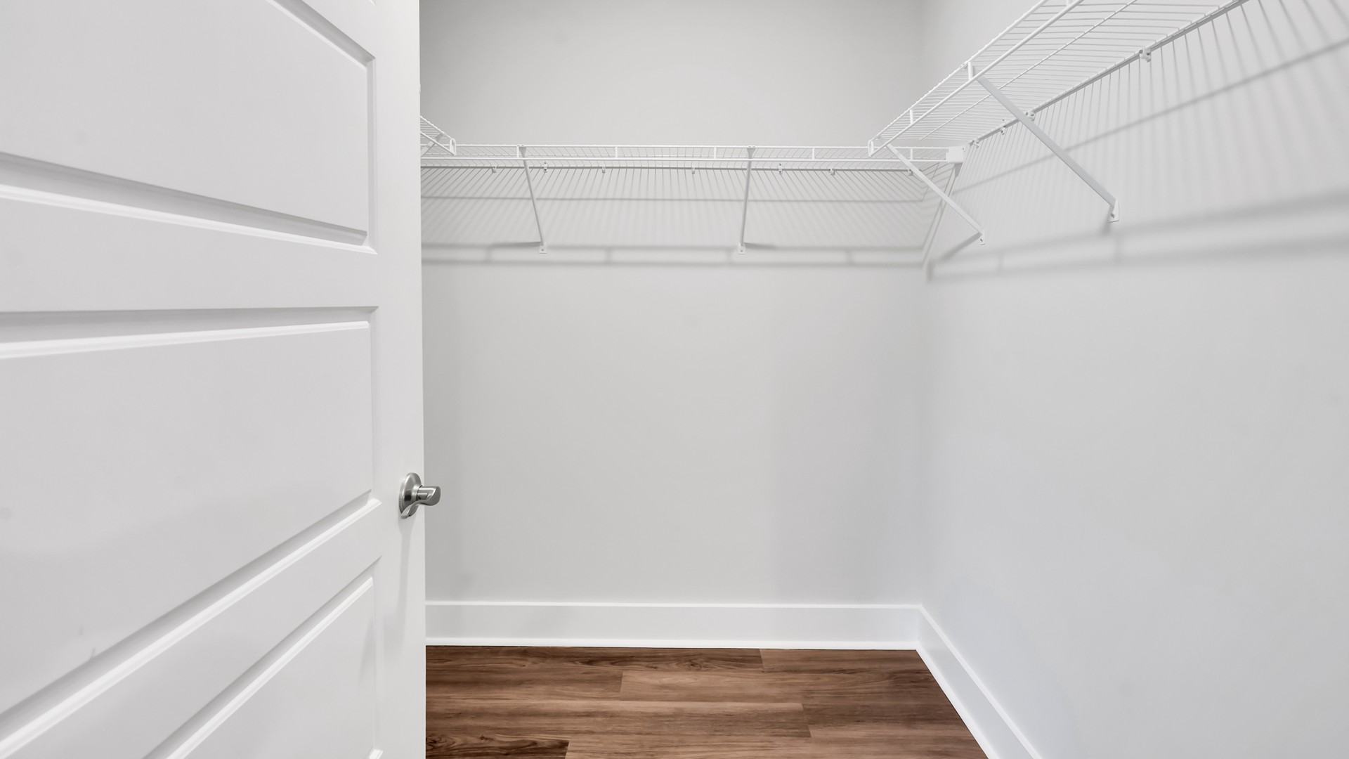 Your primary suite features a 5-foot tiled shower with a frameless glass door and dual vanities for a touch of everyday luxury