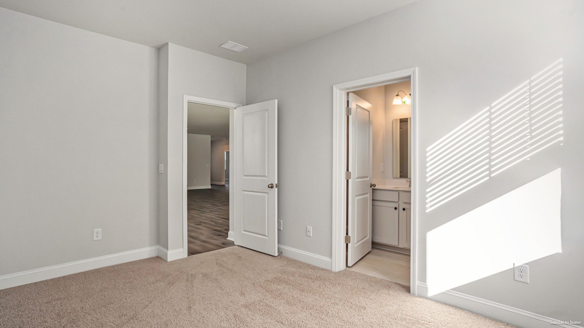 To the right of the Foyer, a hallway leads to bedroom, bath 2, and bedroom 2 This layout separates these rooms from the main living area. To the left of the main living area, past the breakfast nook, is bedroom 4 and bath 3.