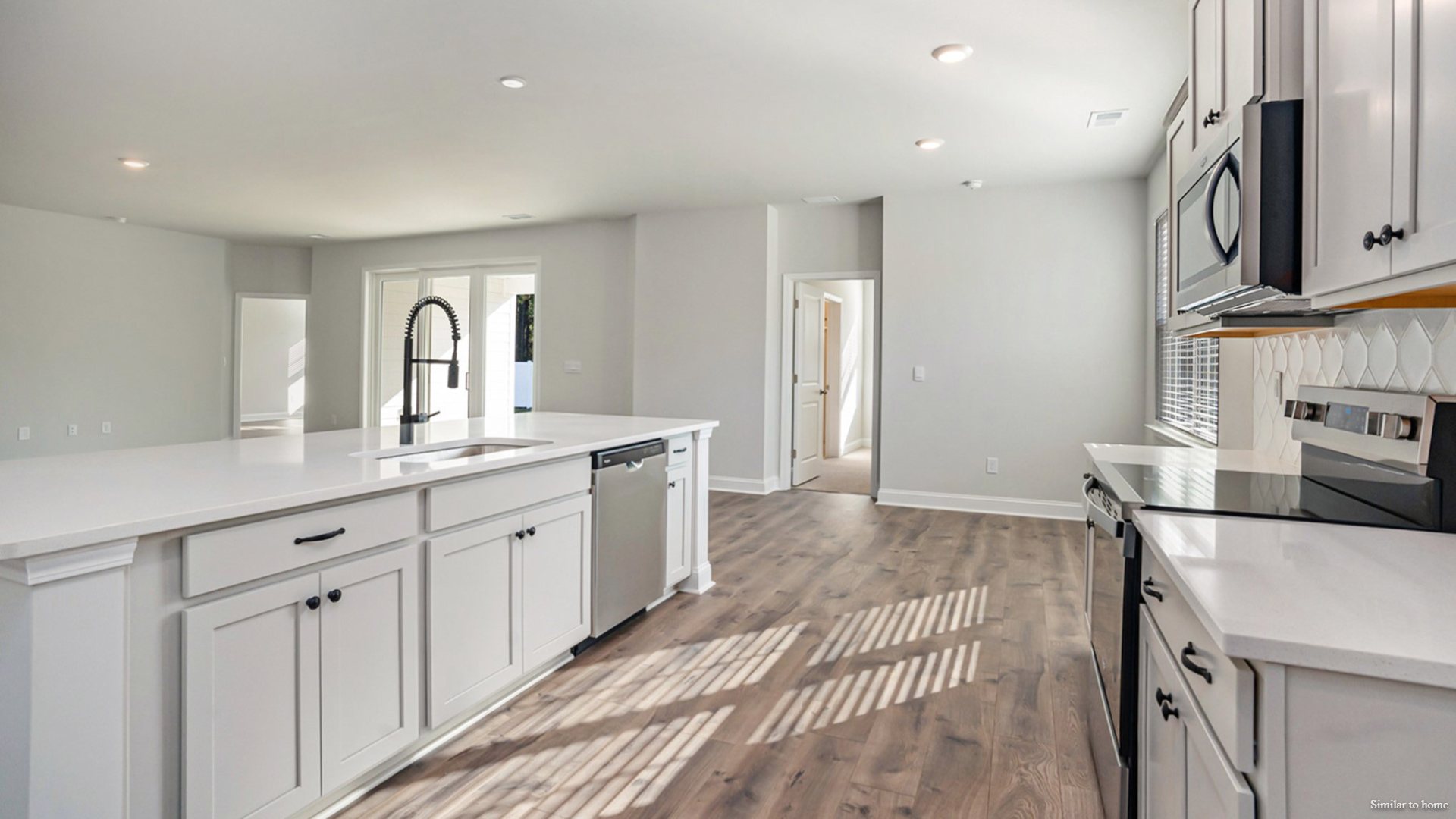 The primary suite and outdoor living: Tucked away in the rear right corner is the primary bedroom, offering privacy from the rest of the house. It includes a generous primary bath and a large walk-in closet.