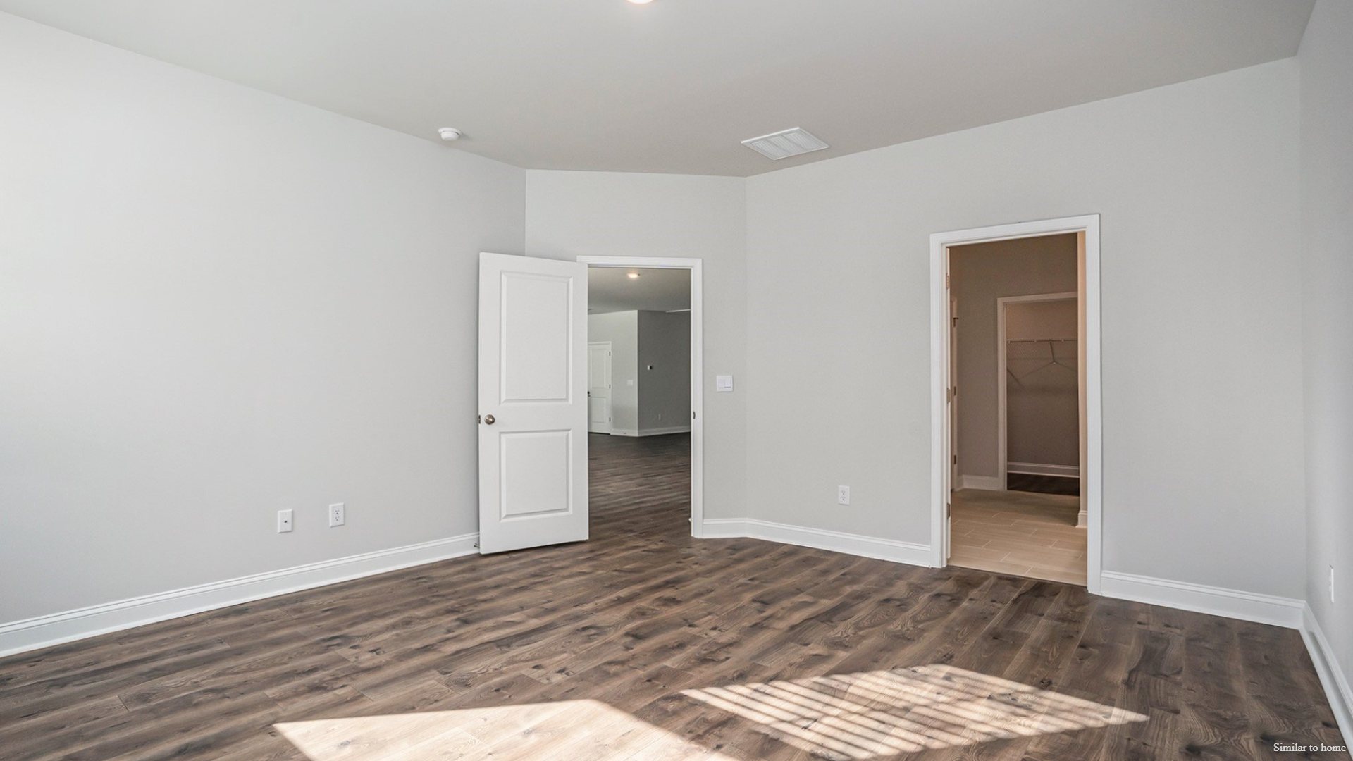 The primary suite and outdoor living: Tucked away in the rear right corner is the primary bedroom, offering privacy from the rest of the house. It includes a generous primary bath and a large walk-in closet.