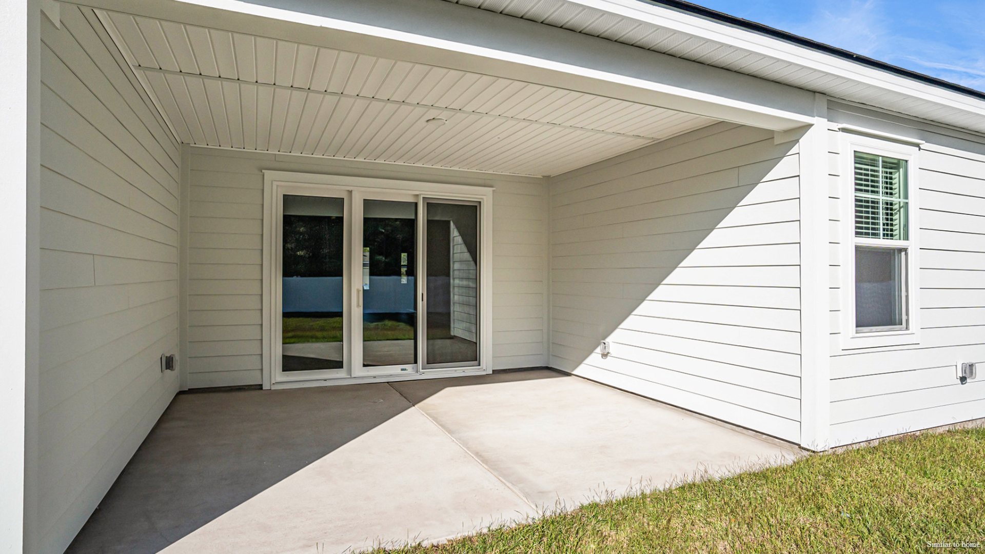 A significant covered porch is accessible from the main living area, perfect for outdoor entertainment.