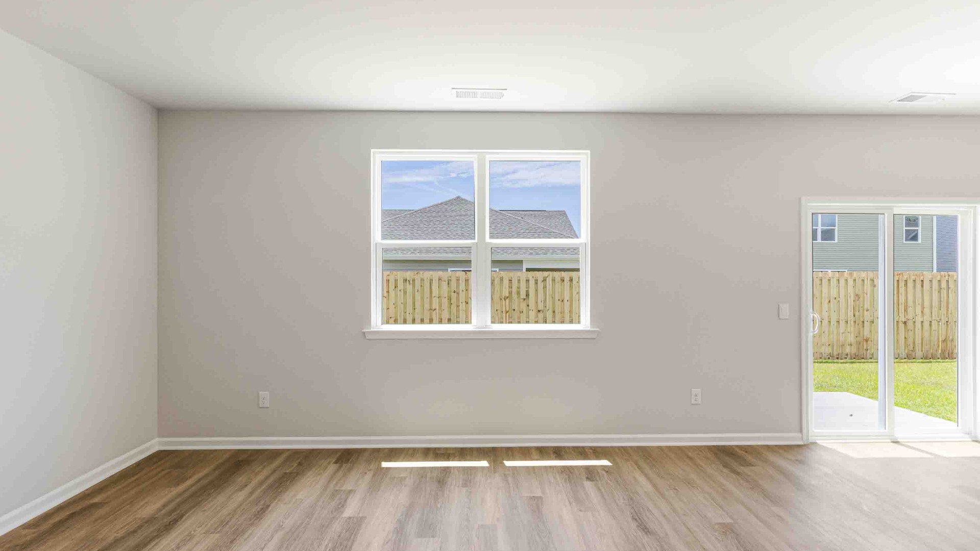 The upstairs has an additional living space, a laundry room, and a Primary Bedroom.