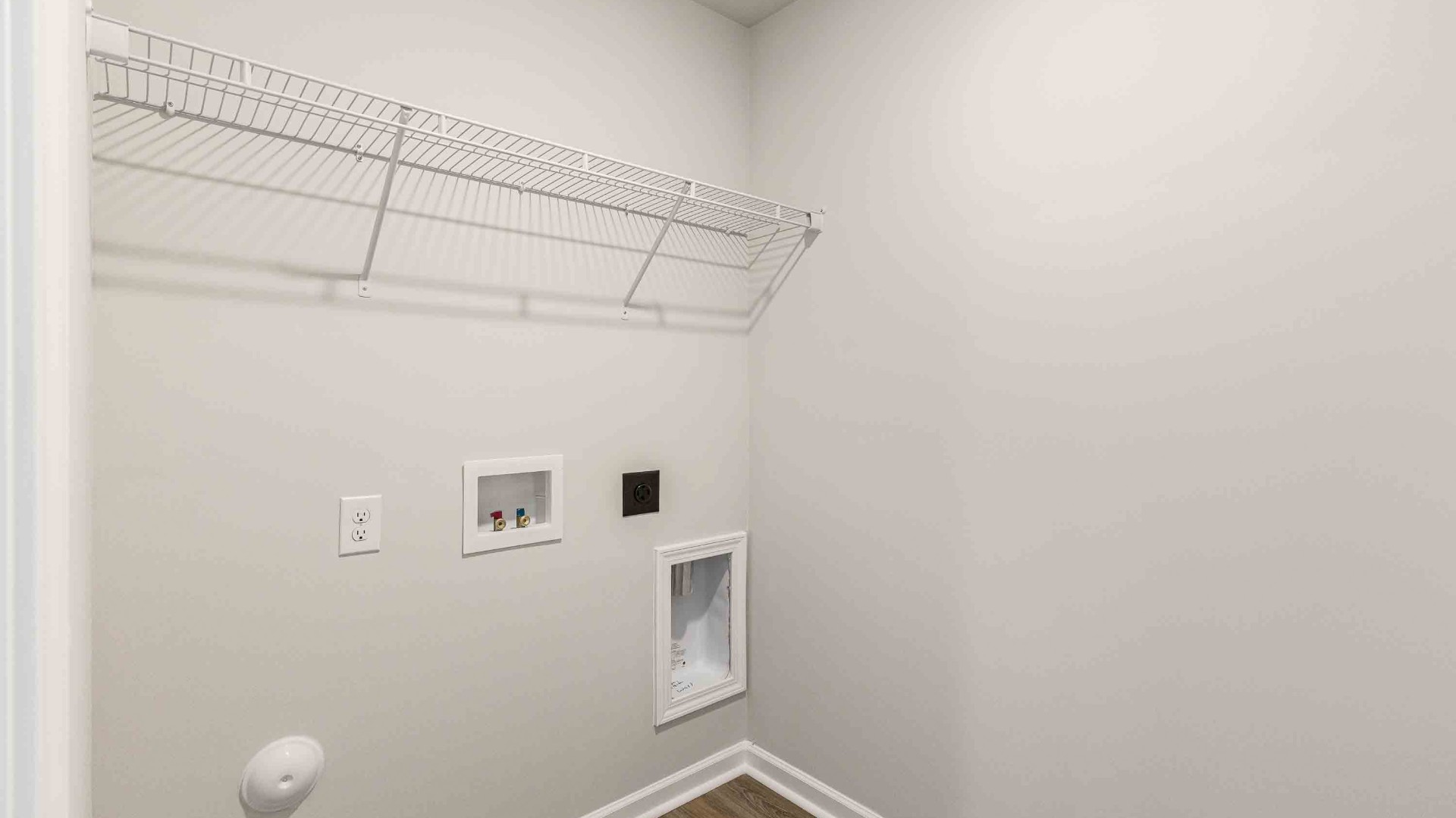 The upstairs has an additional living space, a laundry room, and a Primary Bedroom.