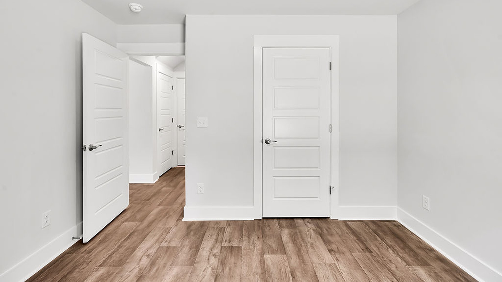The upstairs has an additional living space, a laundry room, and a Primary Bedroom.