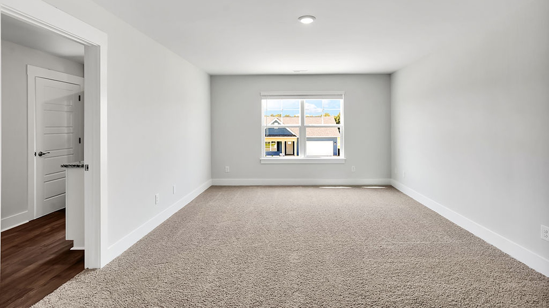 The upstairs has an additional living space, a laundry room, and a Primary Bedroom.