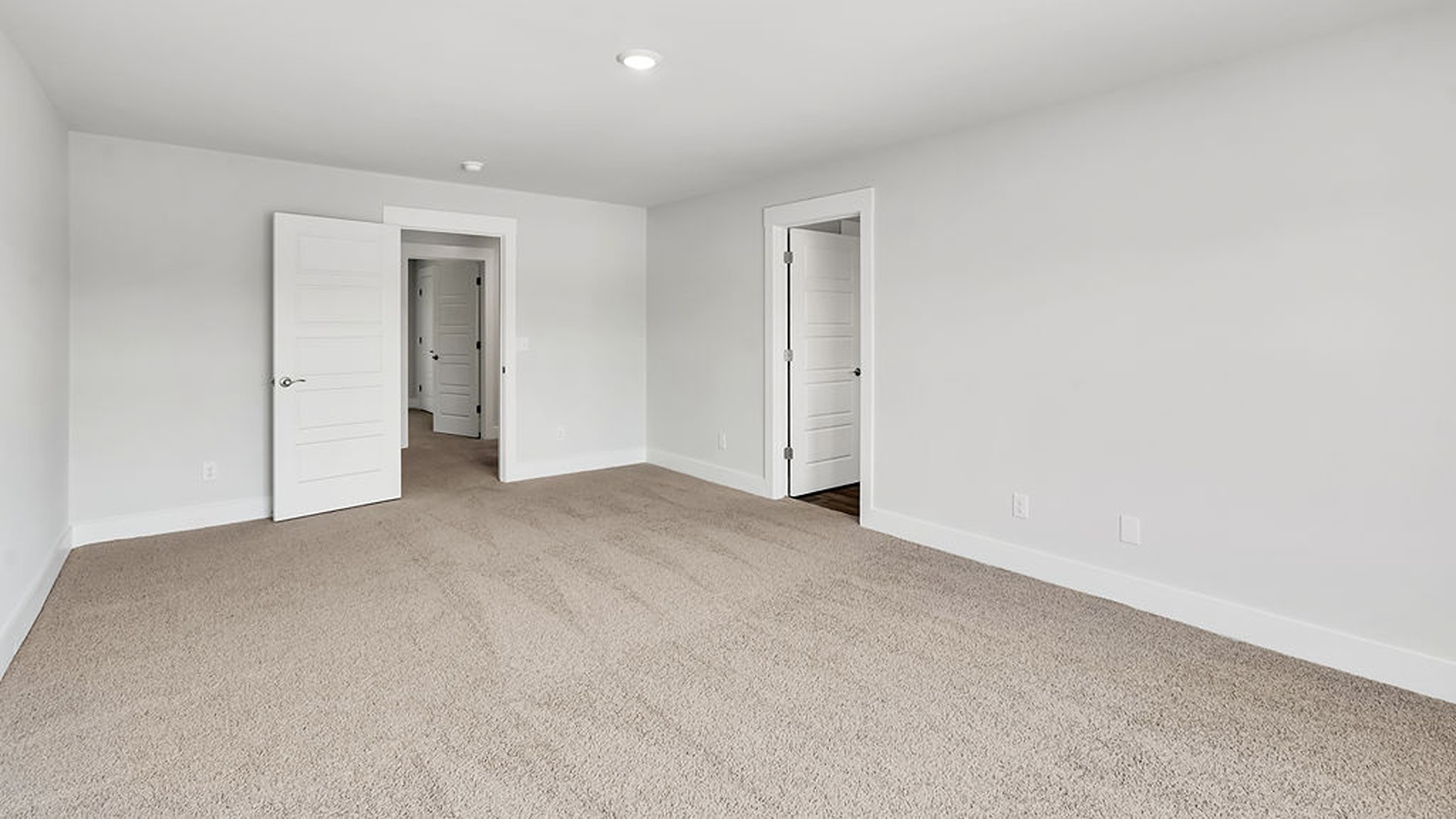 The upstairs has an additional living space, a laundry room, and a Primary Bedroom.