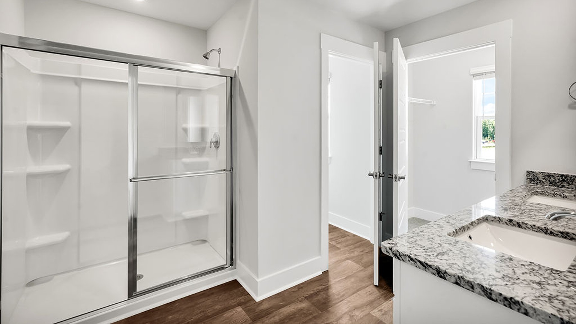The upstairs has an additional living space, a laundry room, and a Primary Bedroom.