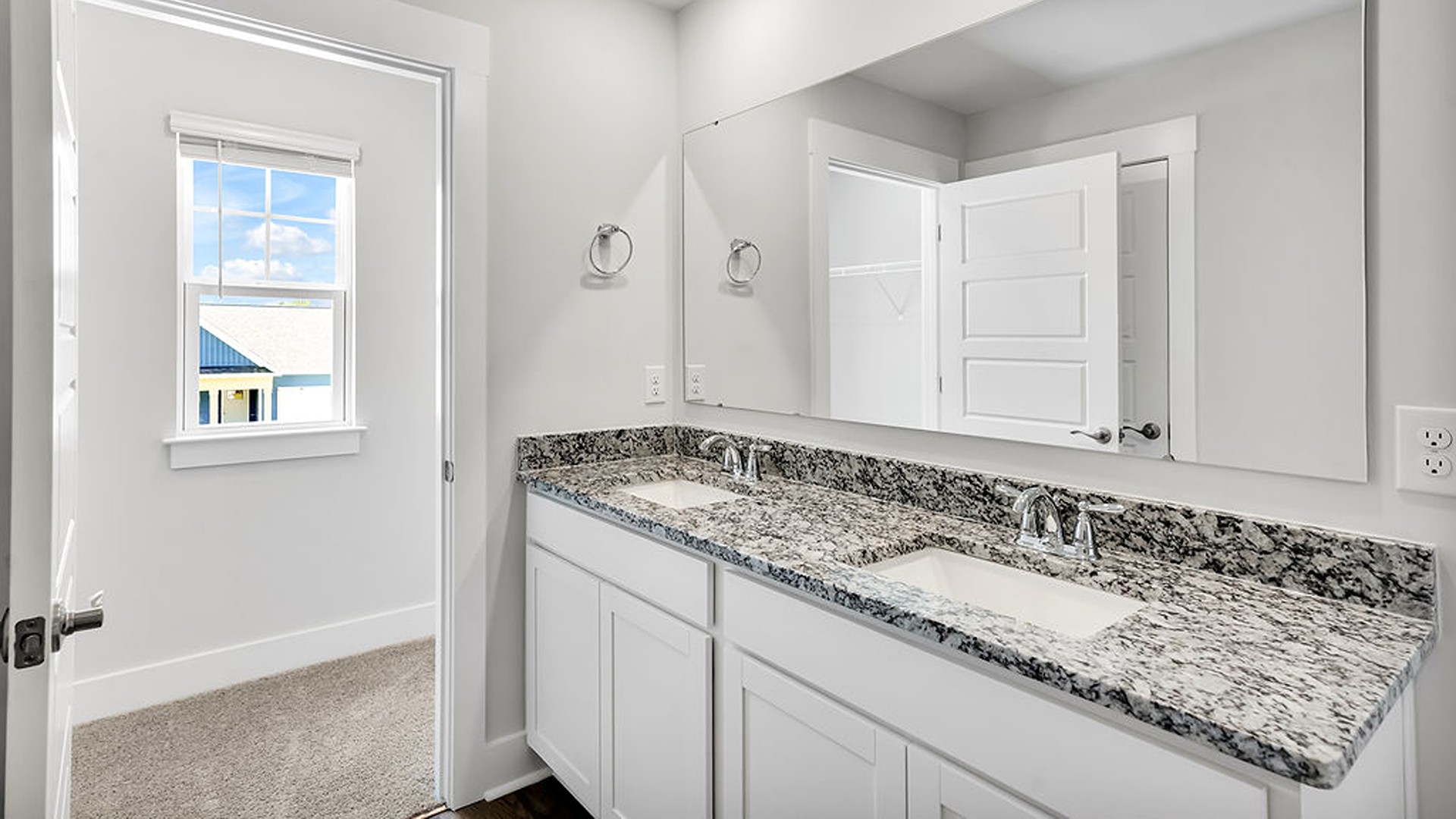 The upstairs has an additional living space, a laundry room, and a Primary Bedroom.