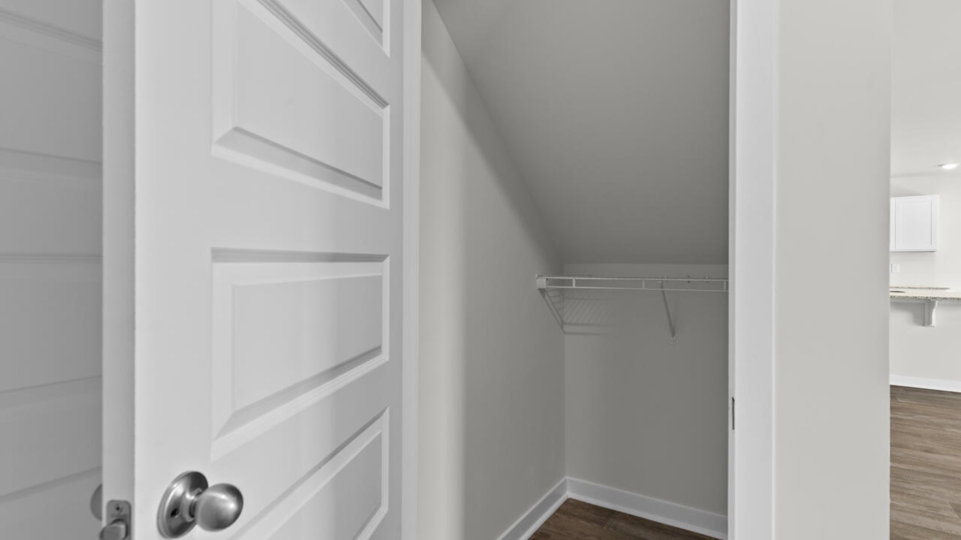 The upstairs has an additional living space, a laundry room, and a primary bedroom