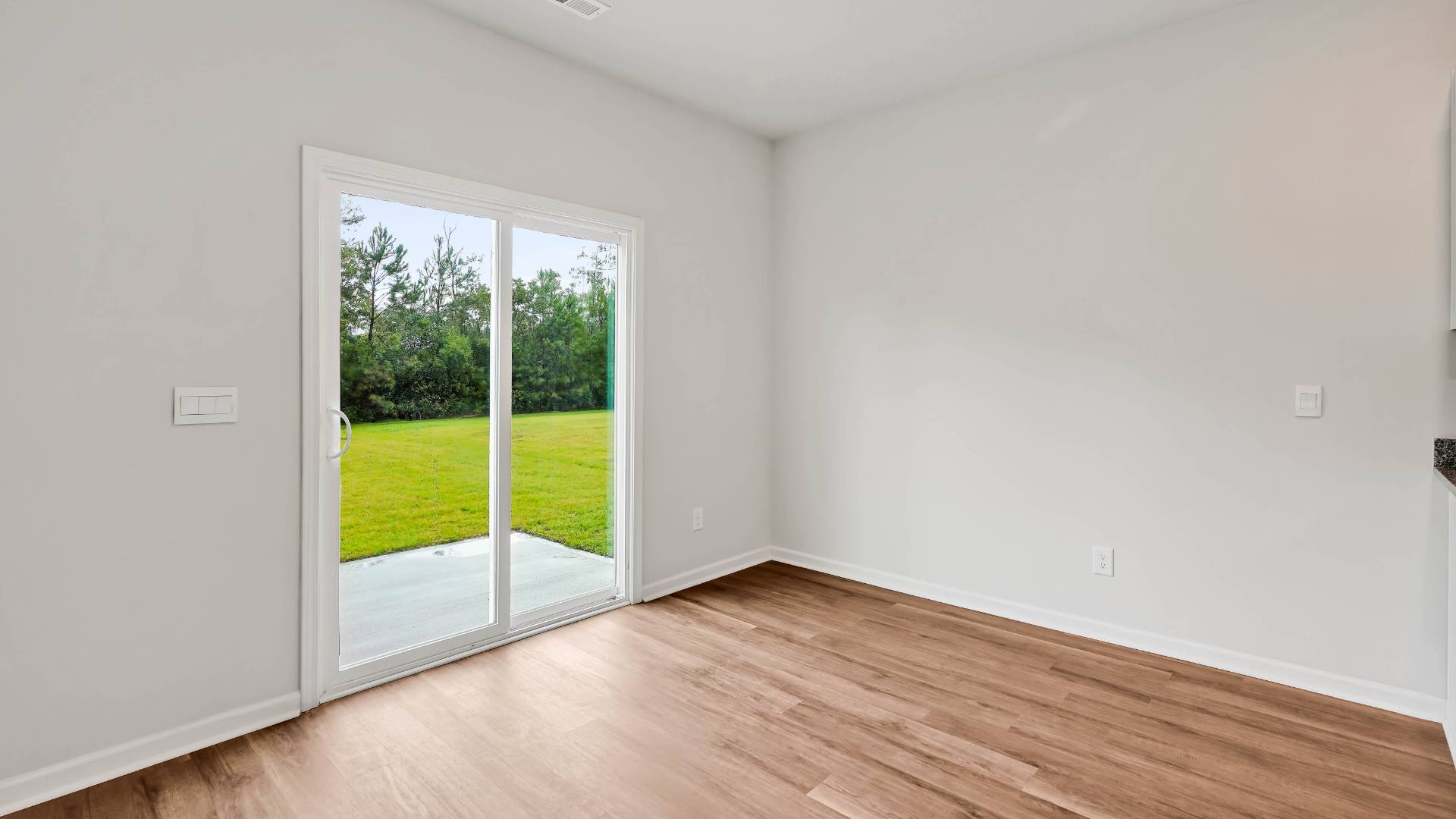 The kitchen seamlessly connects to the dining and living areas, creating a great space for entertainment. Downstairs, a flex room can be used as an office or sitting area