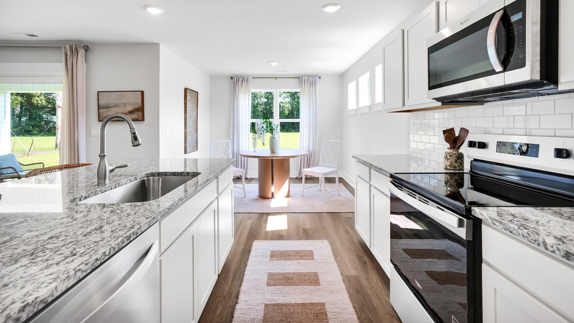 the Guilford is sure to turn heads. Inside this 5 bedroom, 4.5 bathroom home, you’ll find 3,503 square feet of comfortable living. The living area is an open concept, where your kitchen, living, and dining areas blend seamlessly into a space perfect for everyday living and entertaining.
