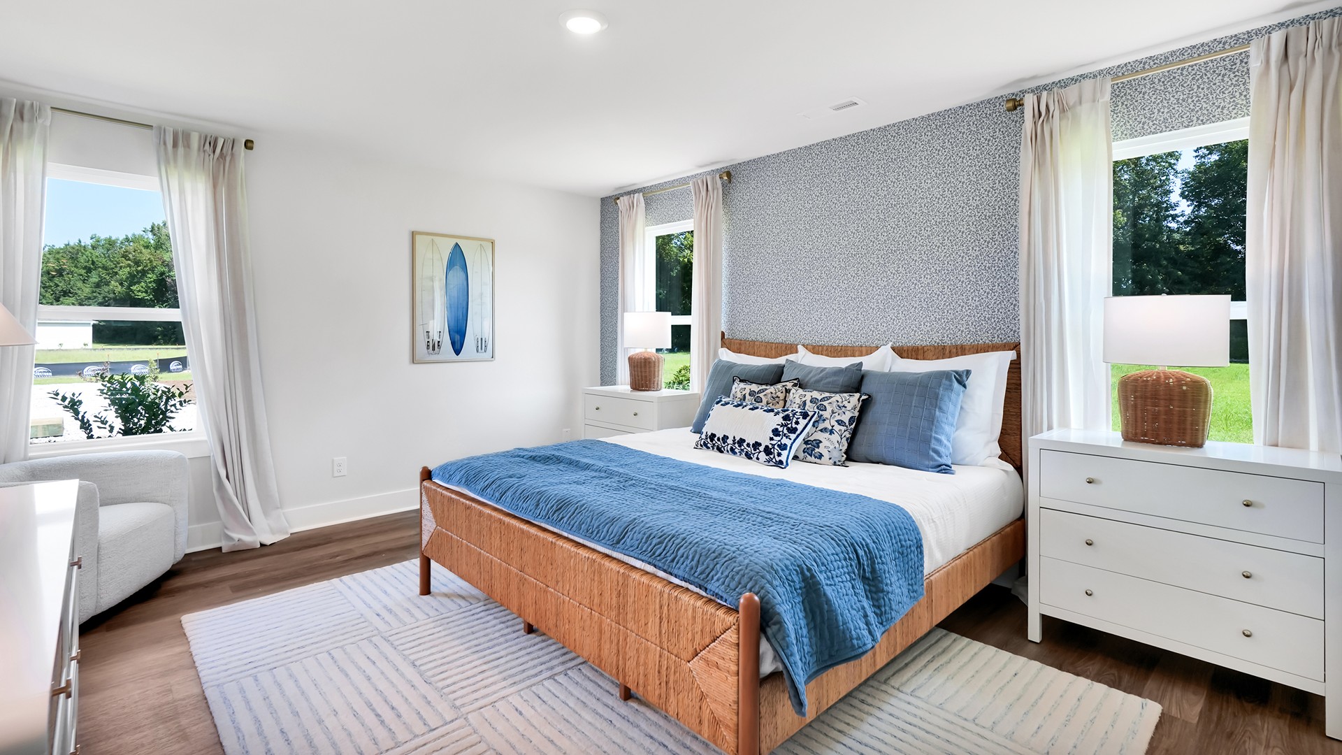 he main level is designed for both functionality and social gatherings, starting with a covered porch that leads into a foyer. From the foyer, you can access a two-car garage and a half bath