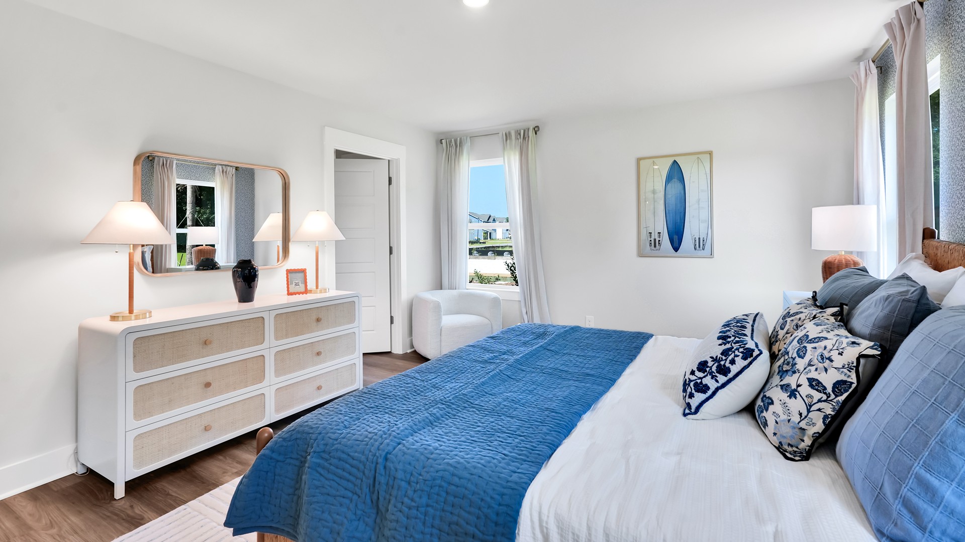 he main level is designed for both functionality and social gatherings, starting with a covered porch that leads into a foyer. From the foyer, you can access a two-car garage and a half bath