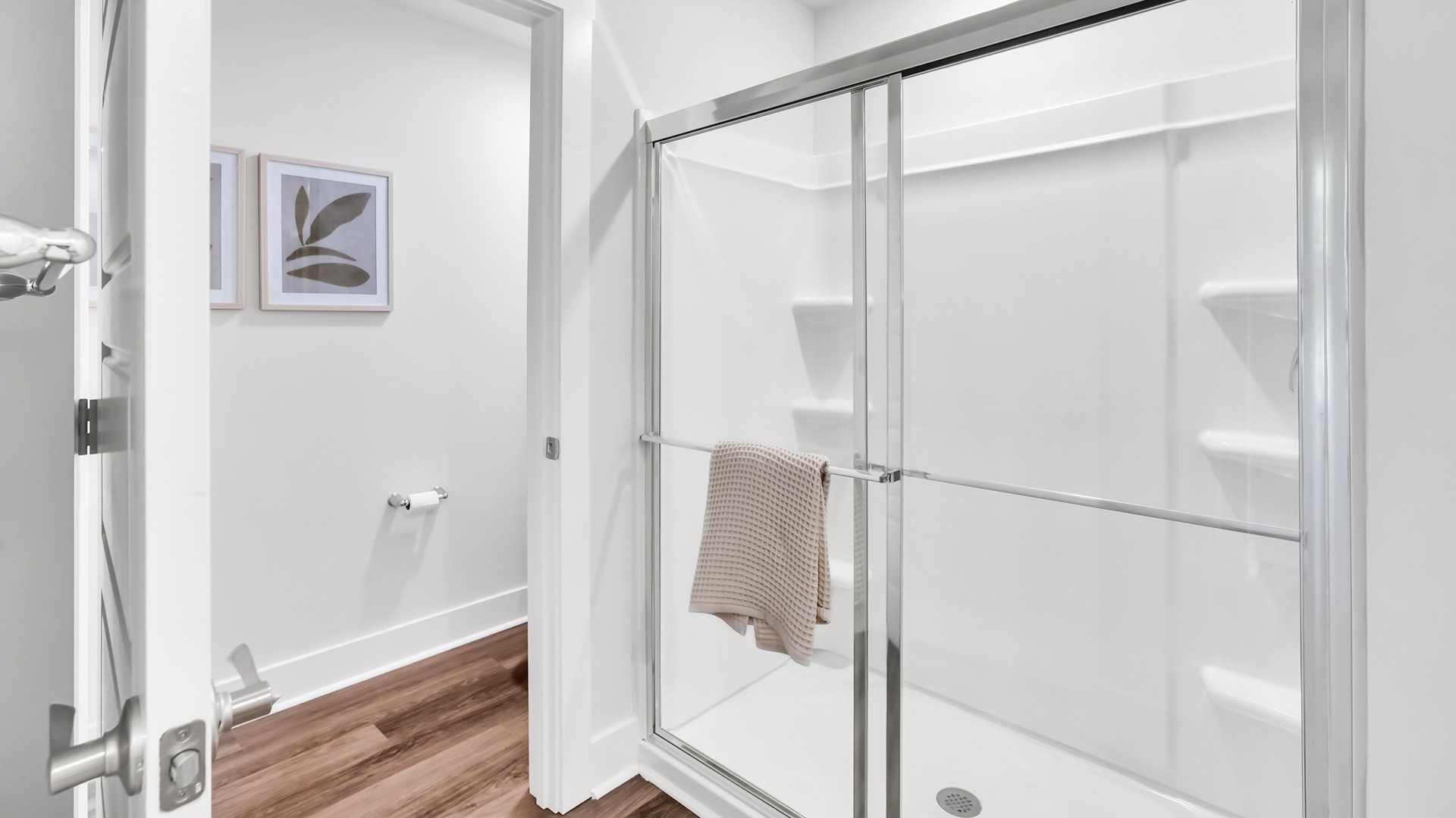 he main level is designed for both functionality and social gatherings, starting with a covered porch that leads into a foyer. From the foyer, you can access a two-car garage and a half bath